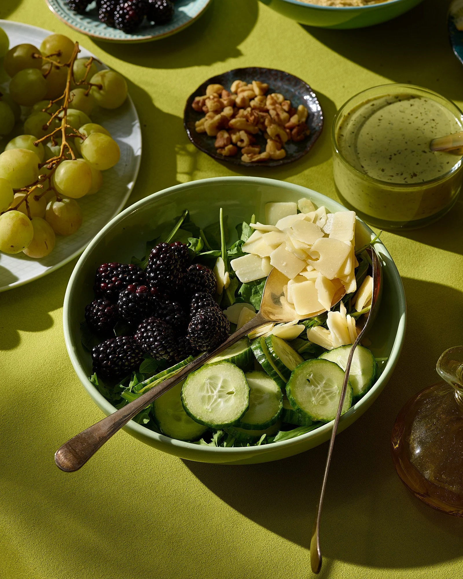Blackberry arugula parmesan cucumber salad chartreuse table committed color editorial food advertising photography by Dhanraj Emanuel, CPG food photographer Greensboro NC