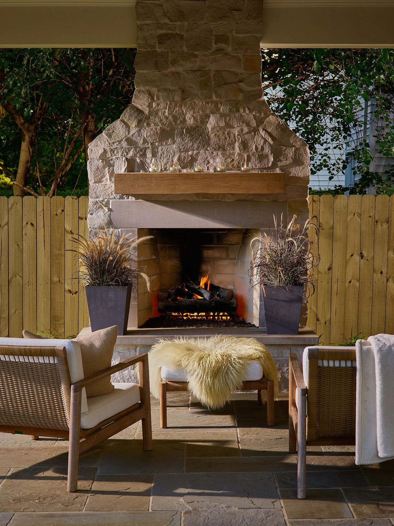 Outdoor fireplace evening fire glow patio seating interior exterior lifestyle photography by Dhanraj Emanuel, interiors photographer Greensboro NC