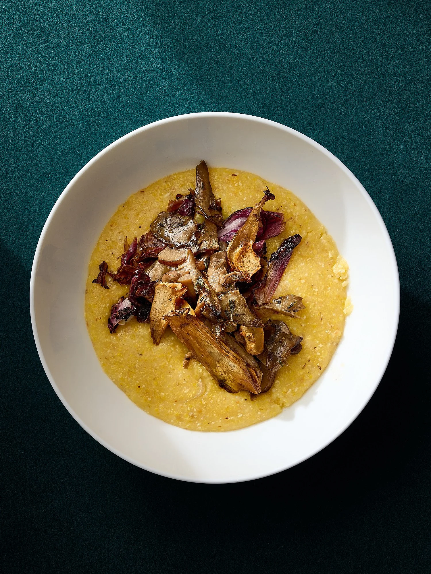 Polenta mushroom deep teal bowl food advertising photography by Dhanraj Emanuel, editorial food photographer Greensboro NC