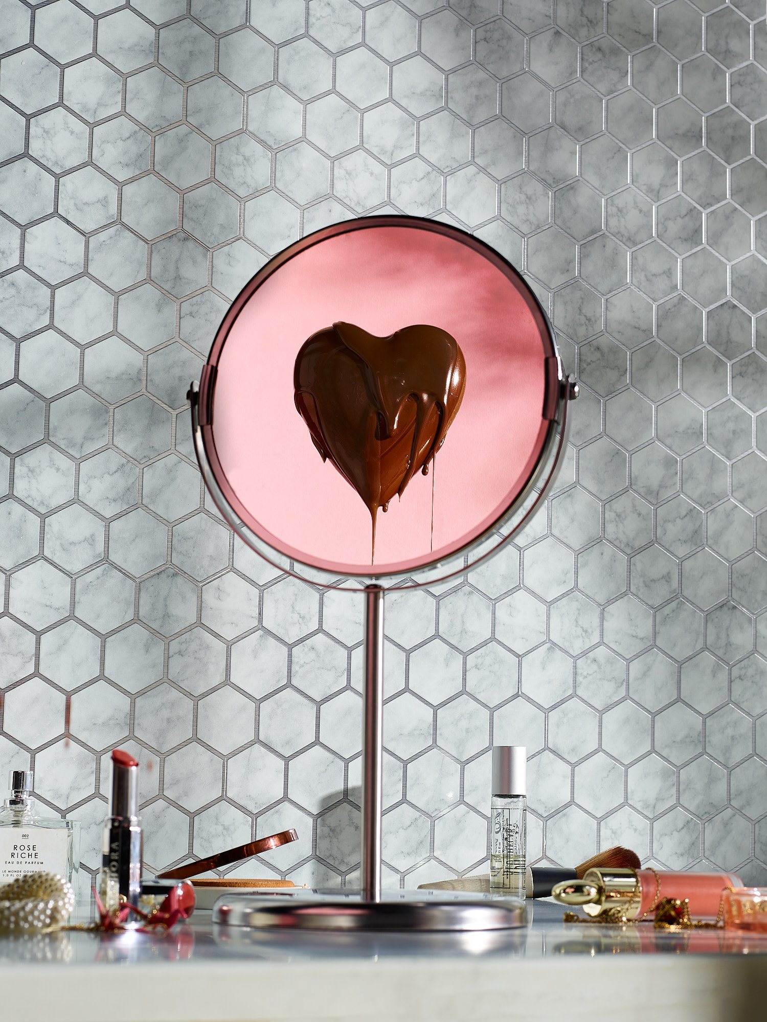 Valentine's Day heart chocolate pink mirror honeycomb tile conceptual beauty food advertising photography by Dhanraj Emanuel, studio photographer Greensboro NC
