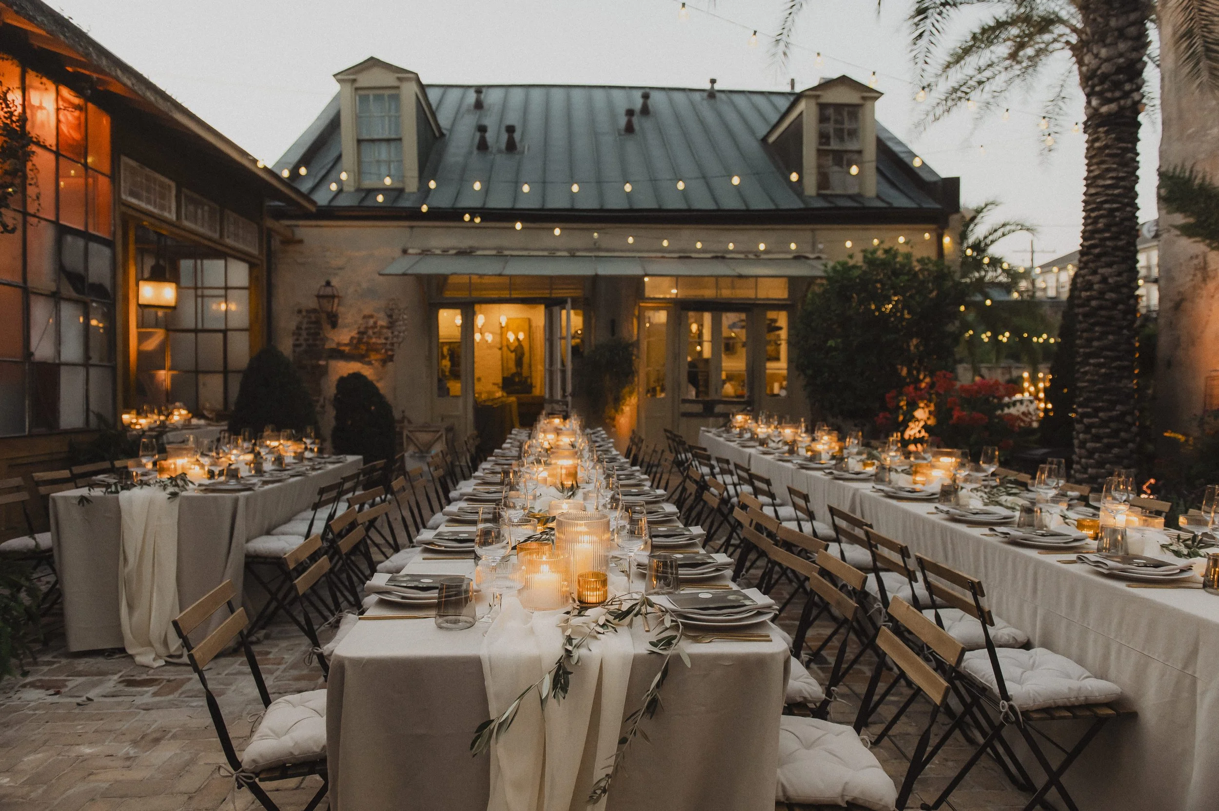 setup.jpg Long dinner tables arranged in the courtyard at Race + Religious