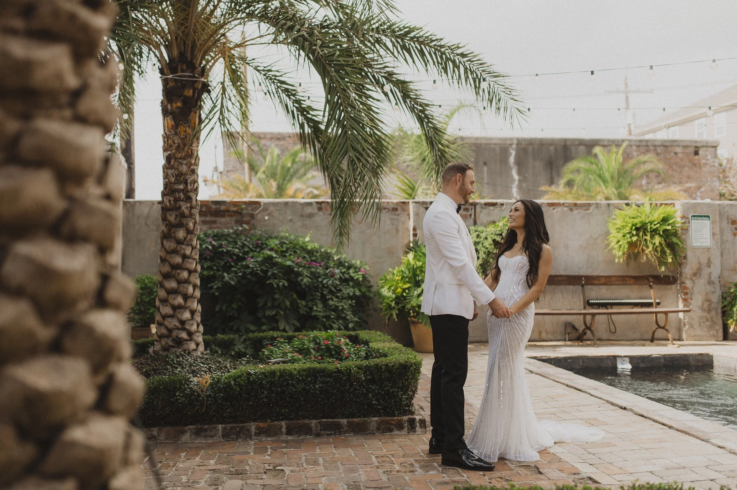 Wedding couple together beside the pool at Race + Religious