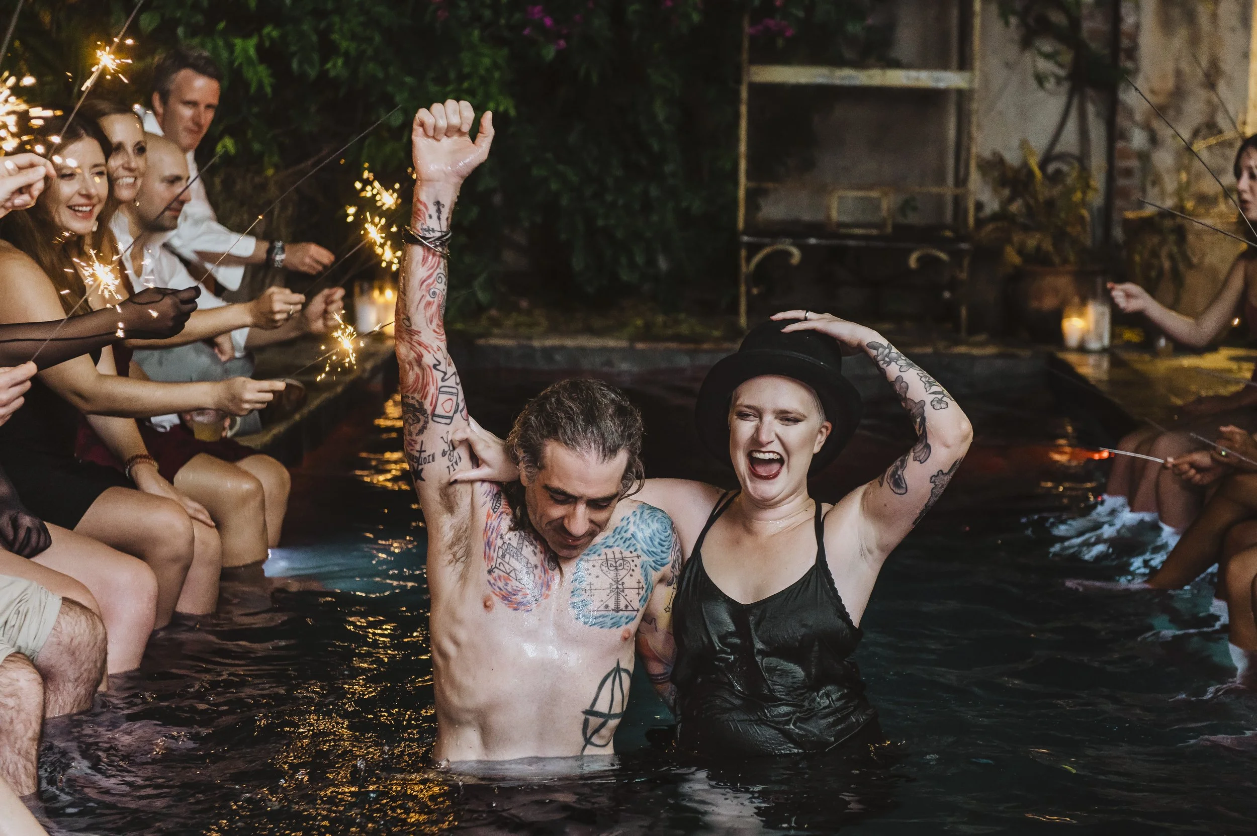Wedding guests dancing beside the pool at Race + Religious