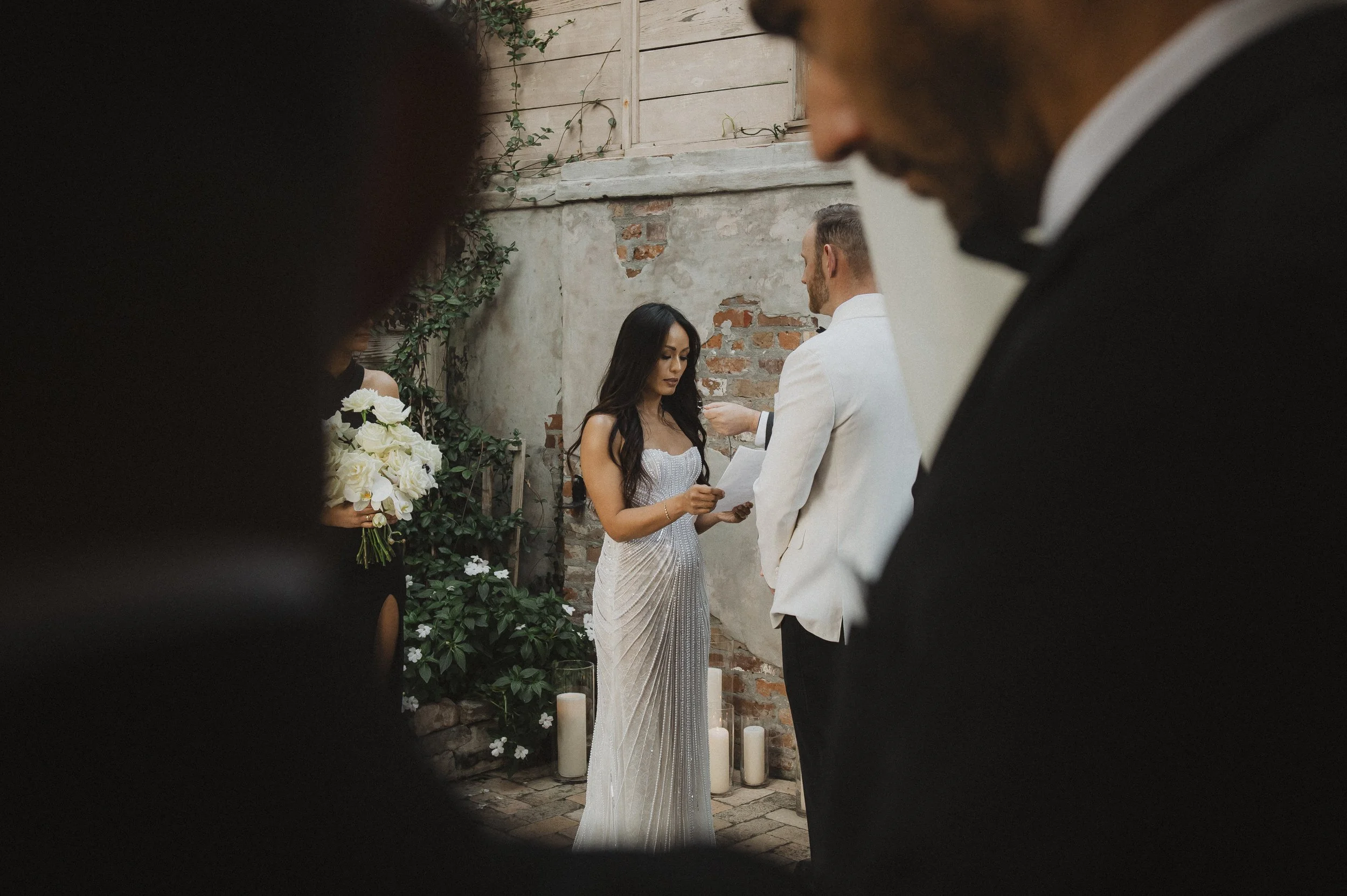ceremony.jpg Couple exchanging vows during a courtyard ceremony at Race + Religious