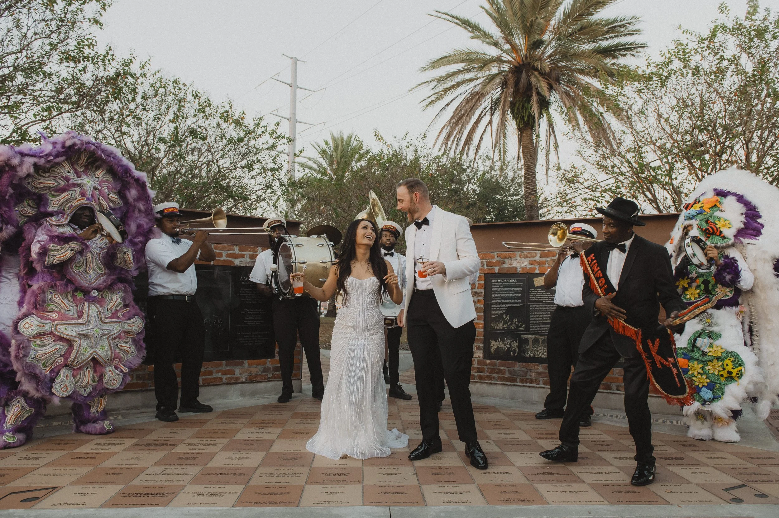 Newlyweds celebrating with Mardi Gras Indians and musicians at Race + Religious
