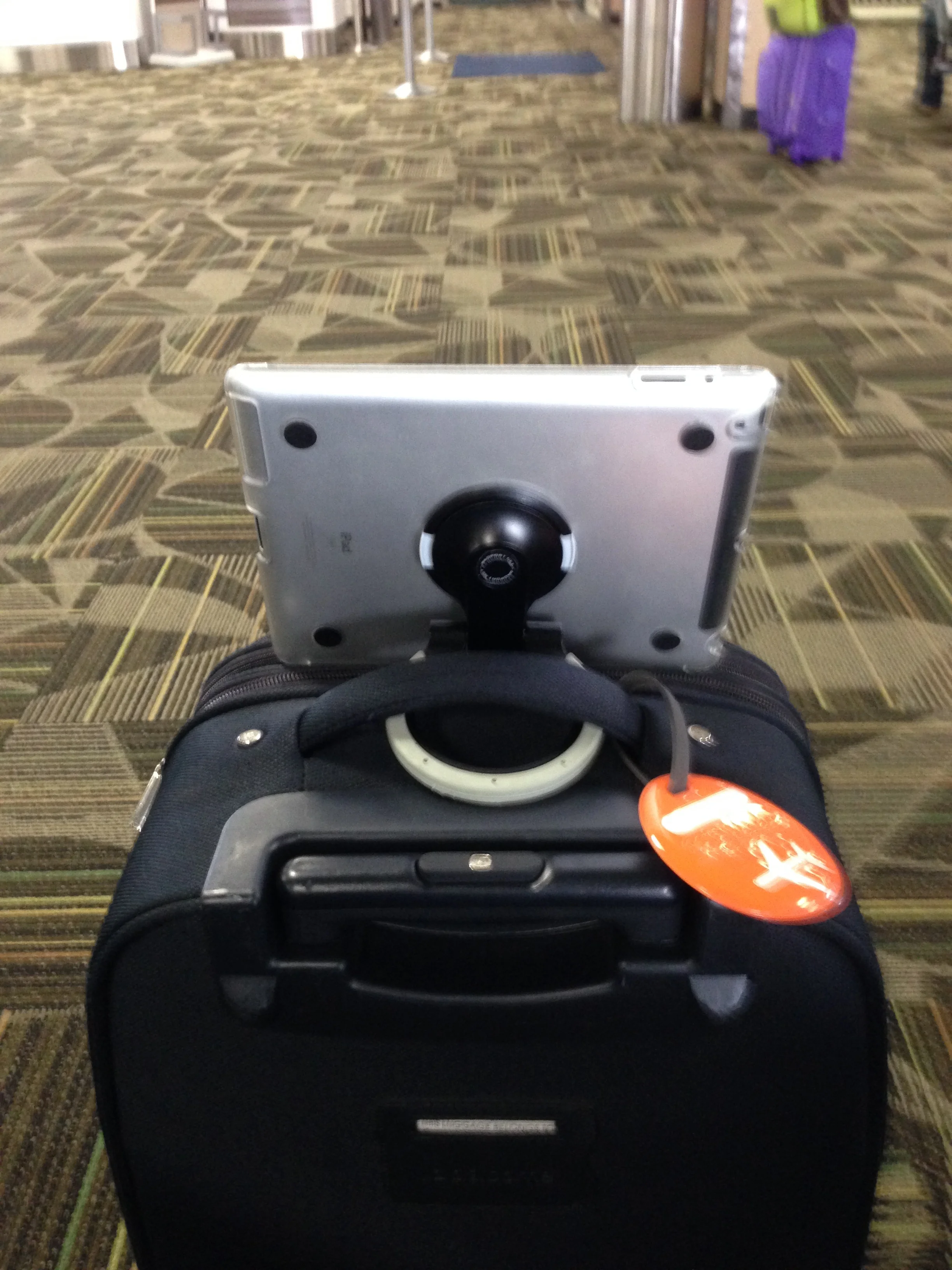 PadStand, rear view, turn your luggage into a portable desk. Insert ring under lugge handle for stability.