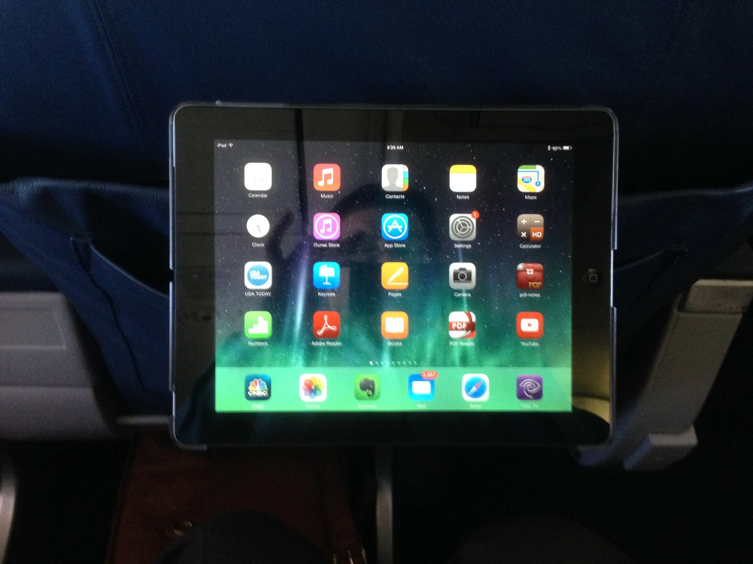 PadStand in landscape mode in plane seat back.