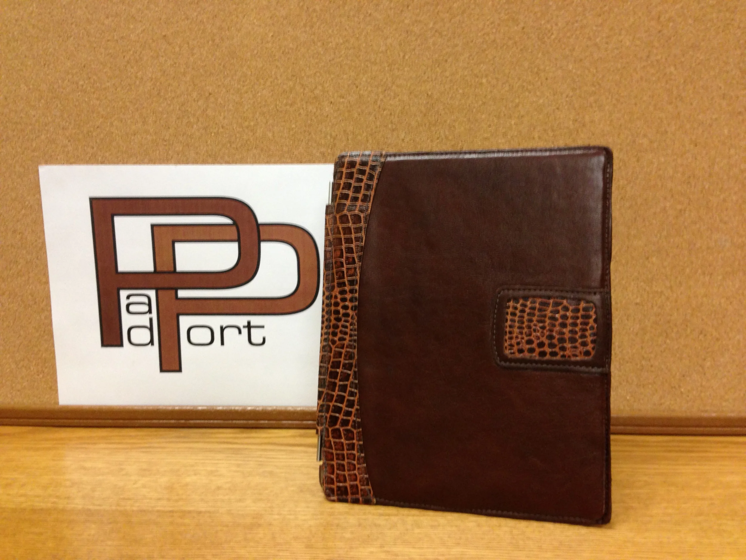 PadStand front view. Leather decorative front with magnetic hinge with buff leather on the inside to keep the screen spotless.