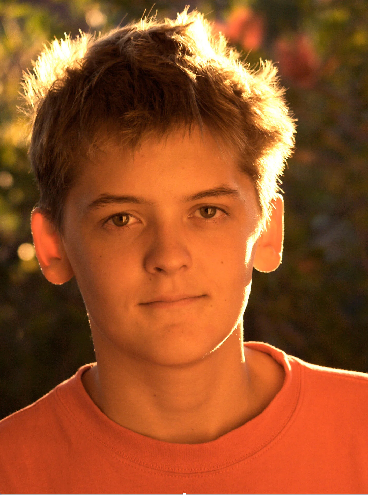 Portrait with backlight, plus a secondary illumination is lighting his face (