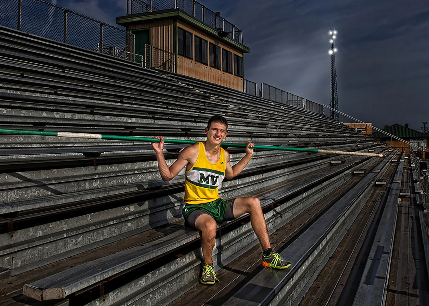 Pole Vaulter in bleachers.