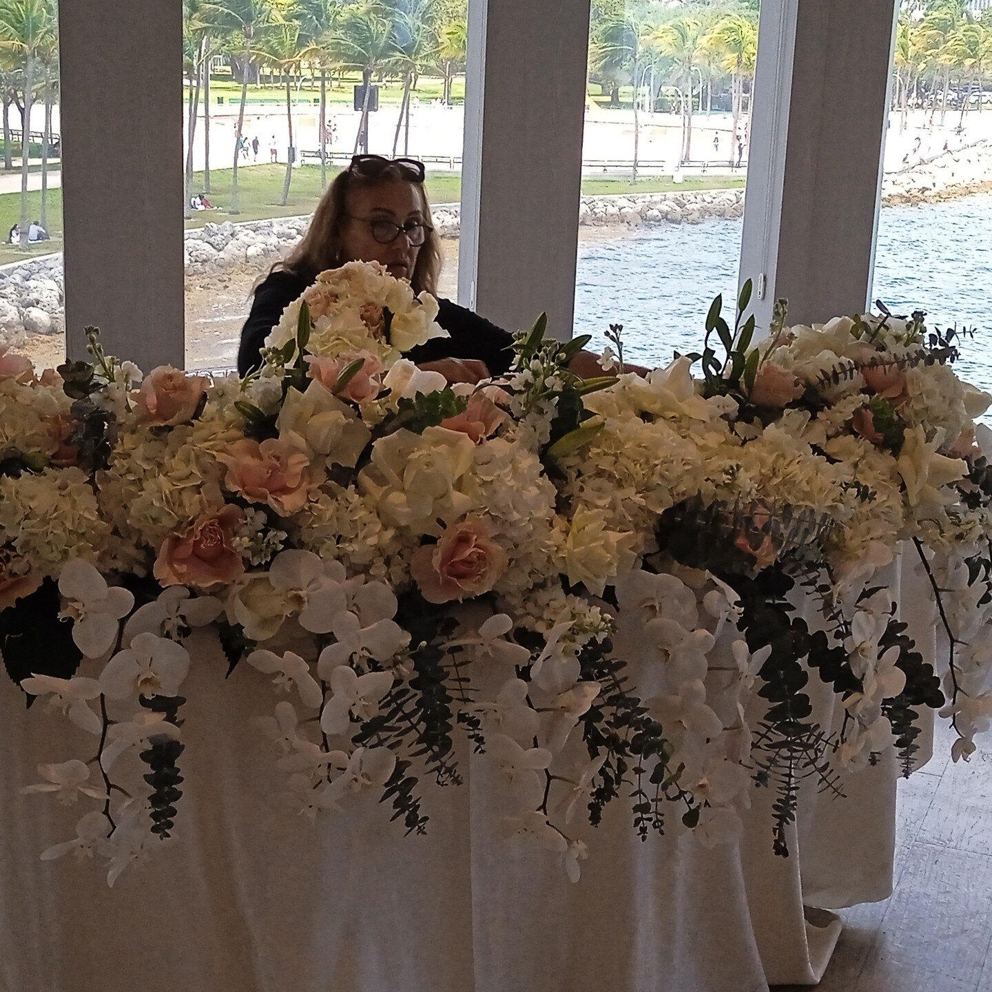 Floral Artist preparing phenomenal decorations to maximize the experience of this unforgetable day!