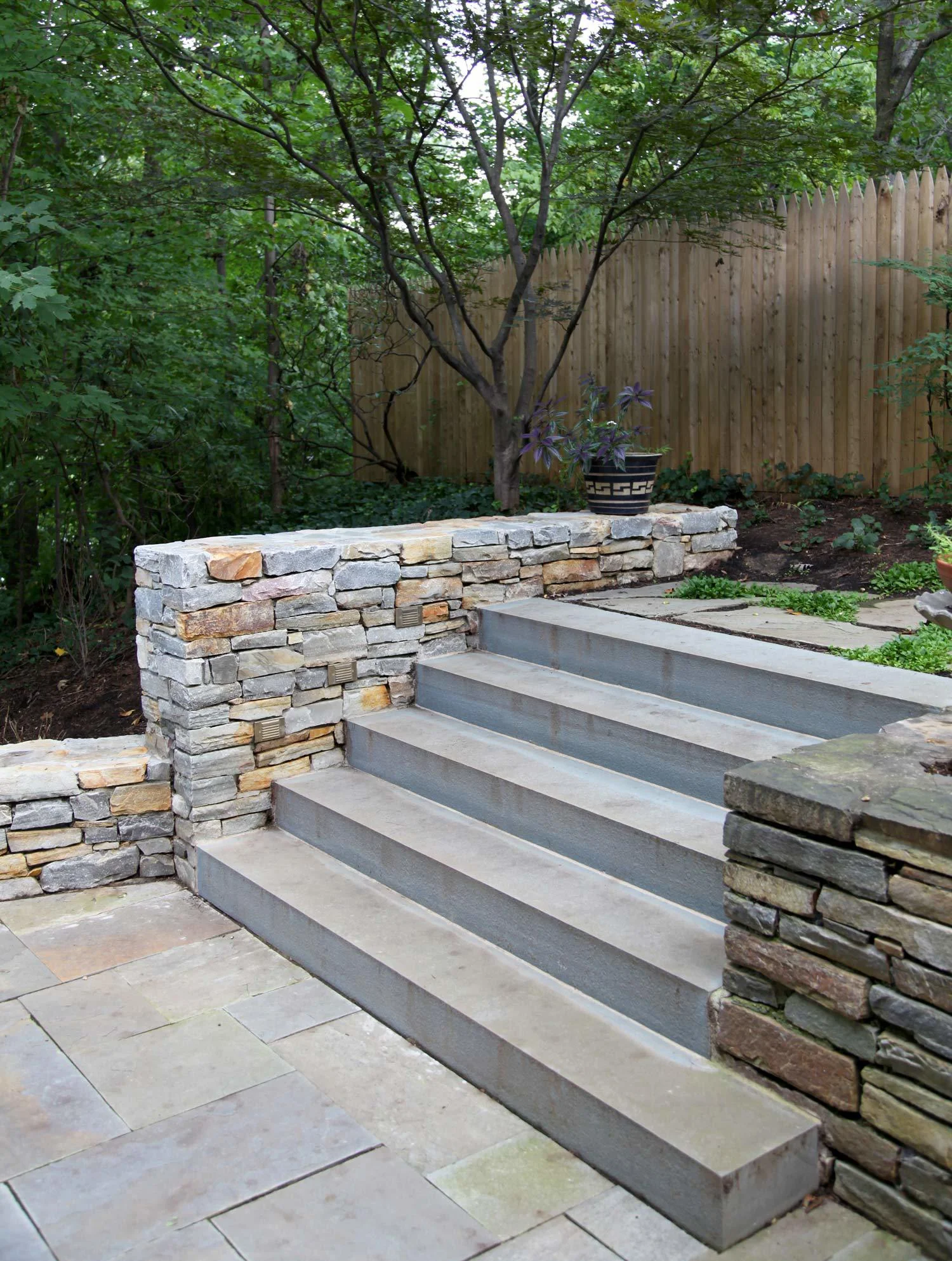 Project Location: Arlington, VA Completion: Spring 2012 General Contractor: Redux Garden & Home Primary Material Palette: full range natural cleft bluestone, select blue thermal finish bluestone, Maryland fieldstone, Bull Run brown and tan stone Photos By: Moody Landscape Architecture (unless noted otherwise)