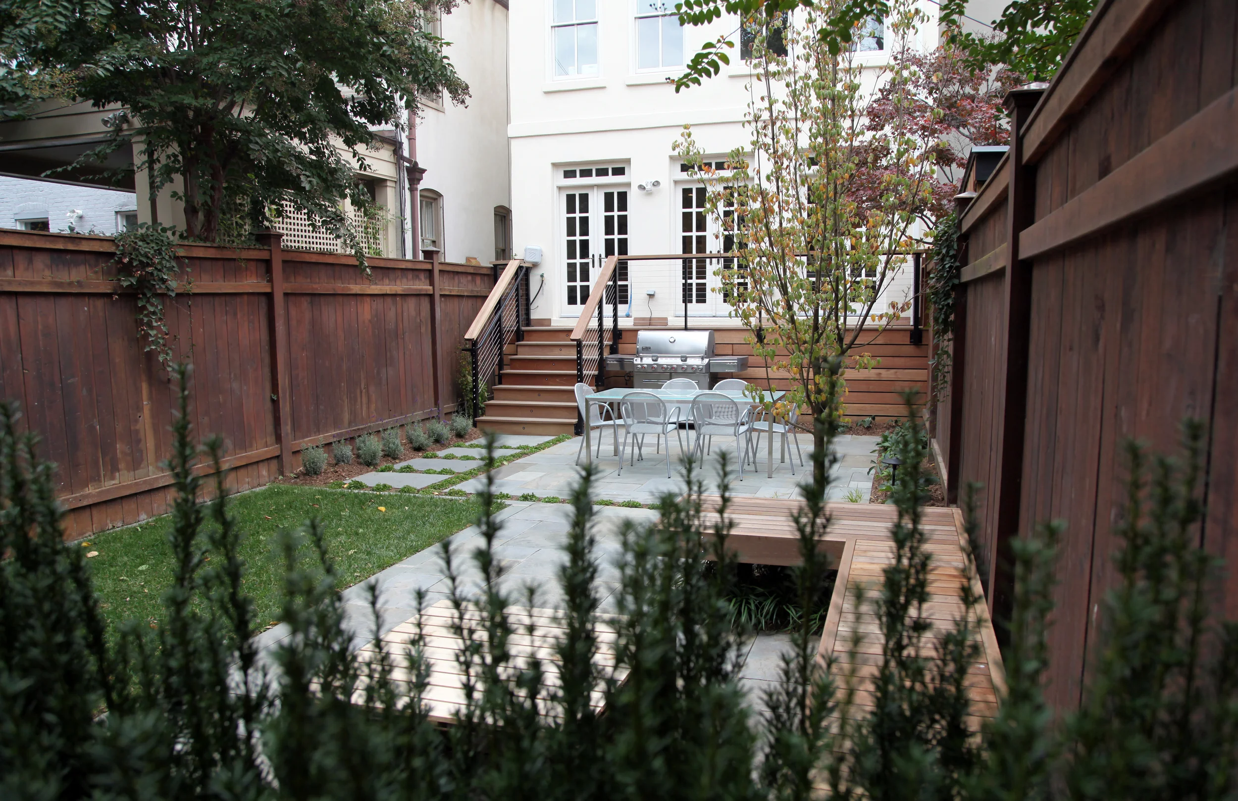 Project Location: Washington, DC (Capitol Hill) Completion: Fall 2014 General Contractor: Denchfield Landscaping Primary Material Palette: full range natural cleft bluestone, mahogany, corten steel Photos By: Moody Landscape Architecture (unless noted otherwise)