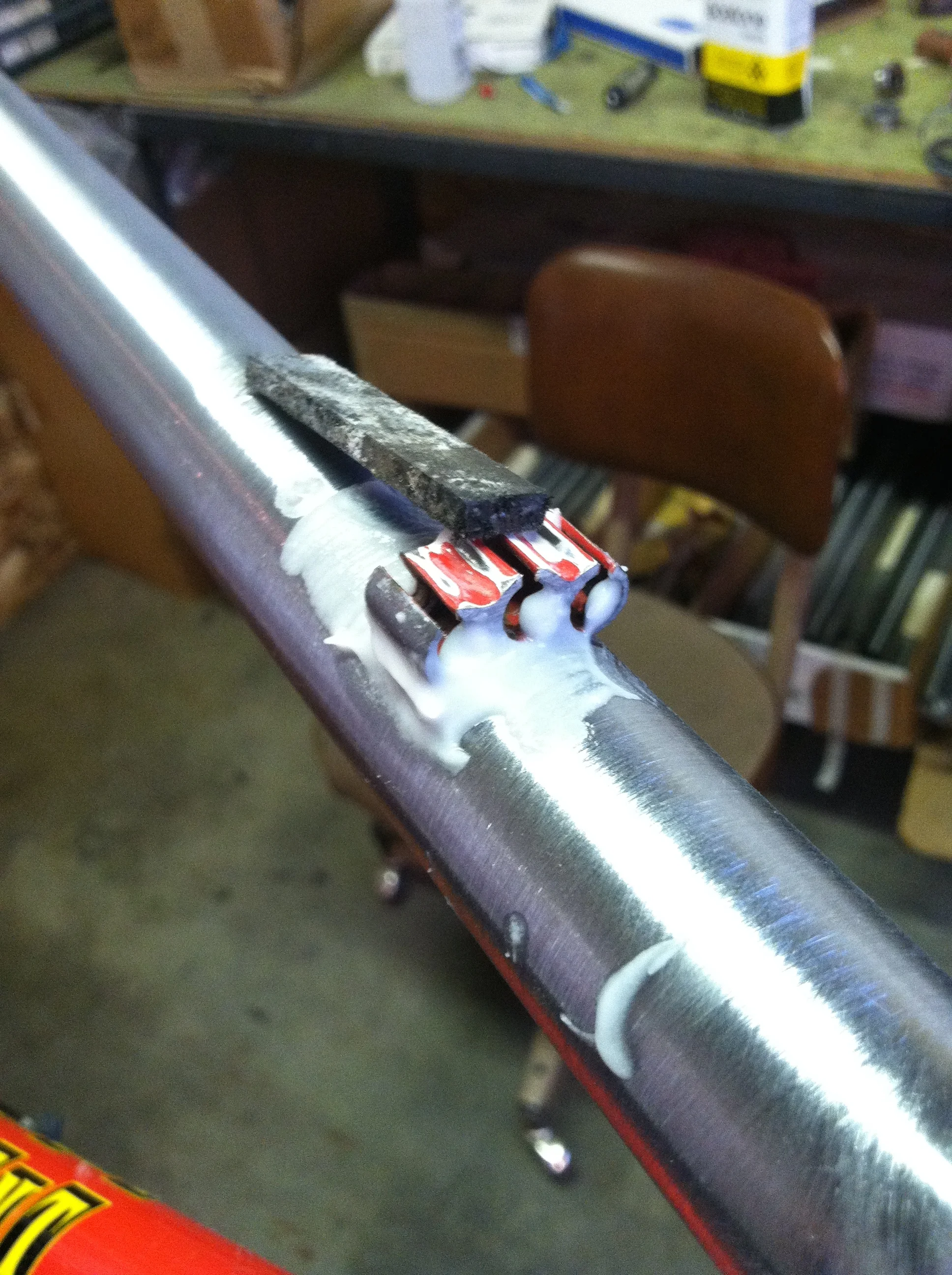 More fixturing. This time using high temp magnets to hold the cable stops in place while brazing. After brazing, the frame goes into the soaking tank to remove the flux.