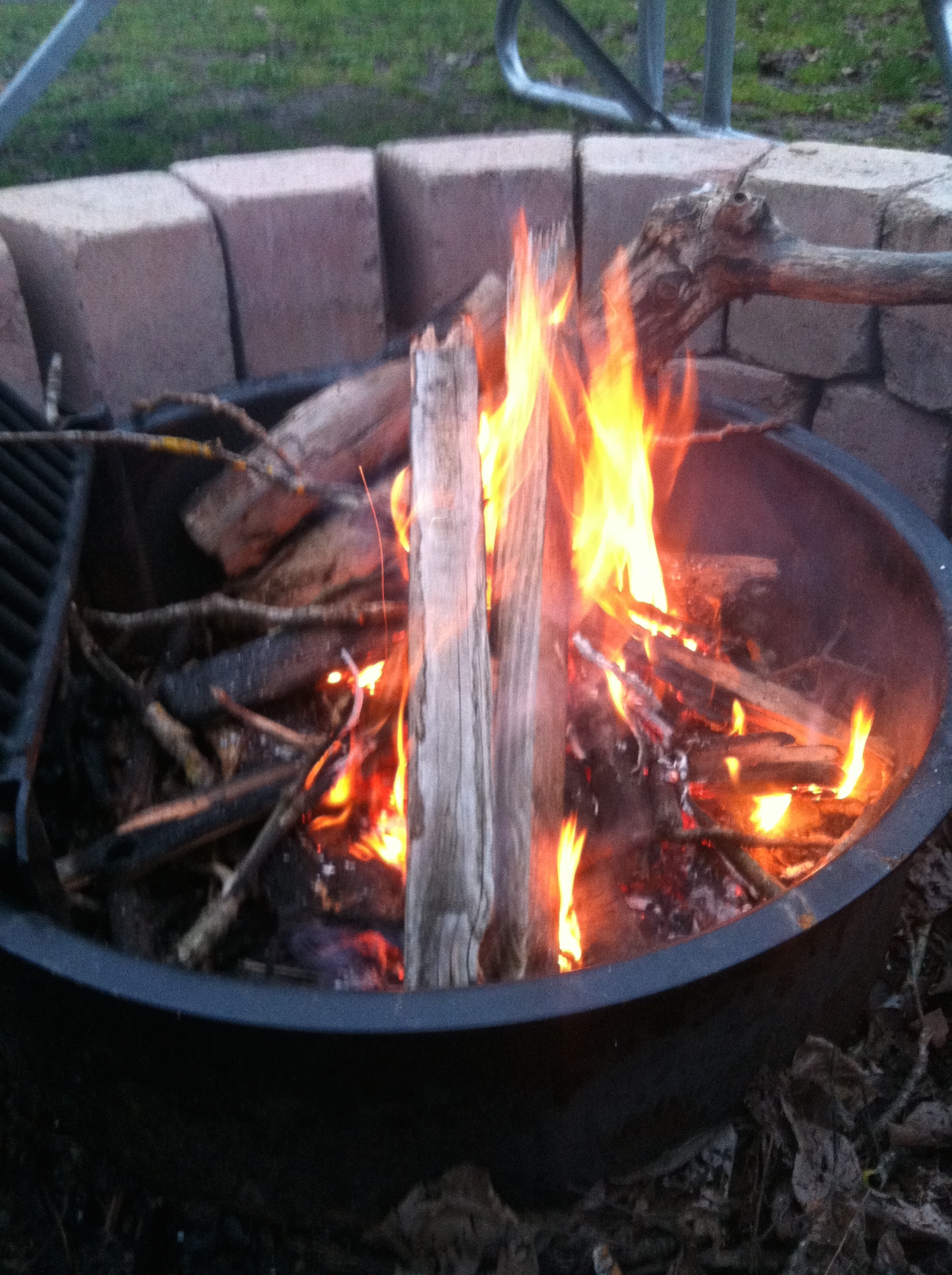 I had a pile of really wet leftover firewood and some twigs the kids picked up off the ground, also wet. And I managed to get this going.