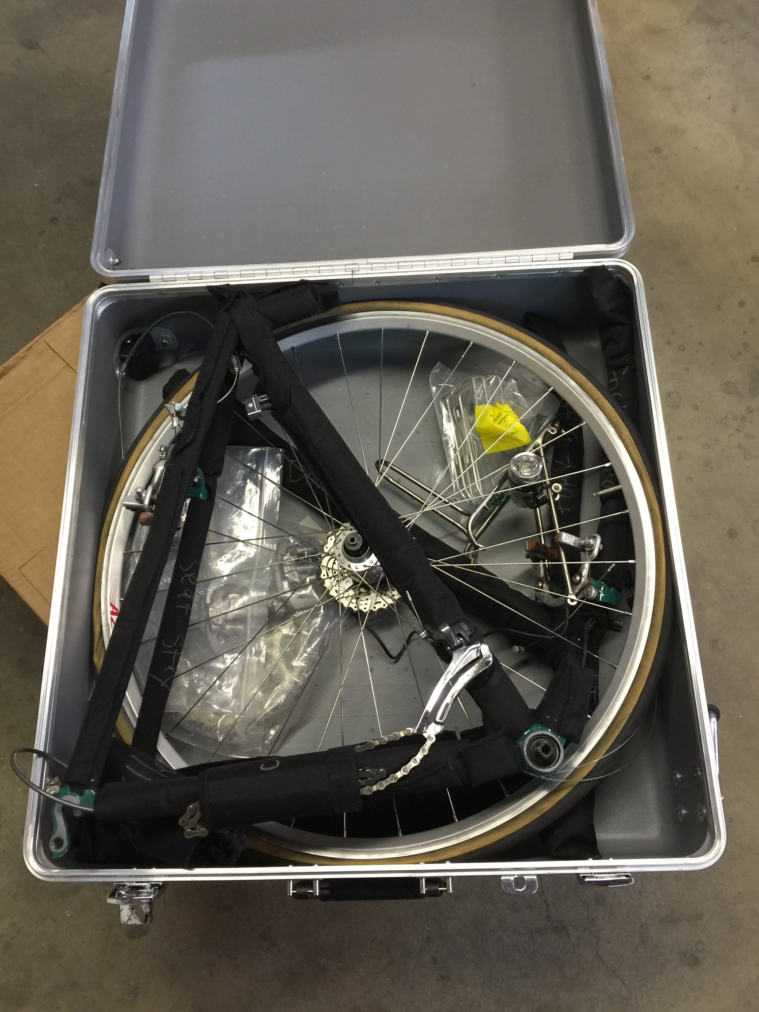 The rear half next. On larger bikes you may have to remove the rear derailleur.