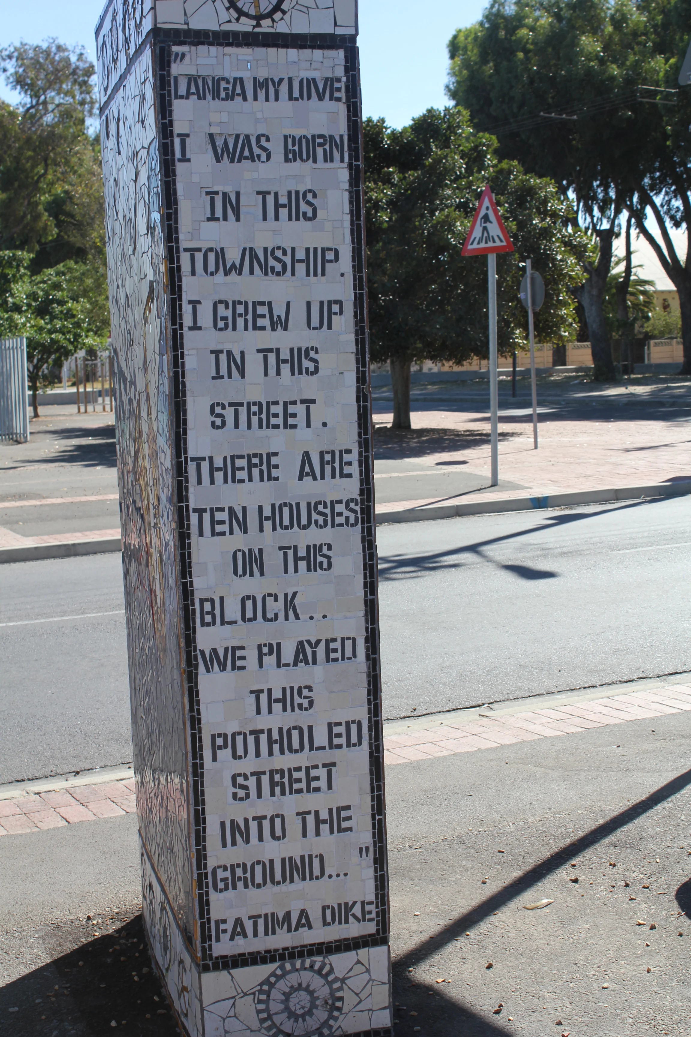 Tile art of history on a street corner in Langa