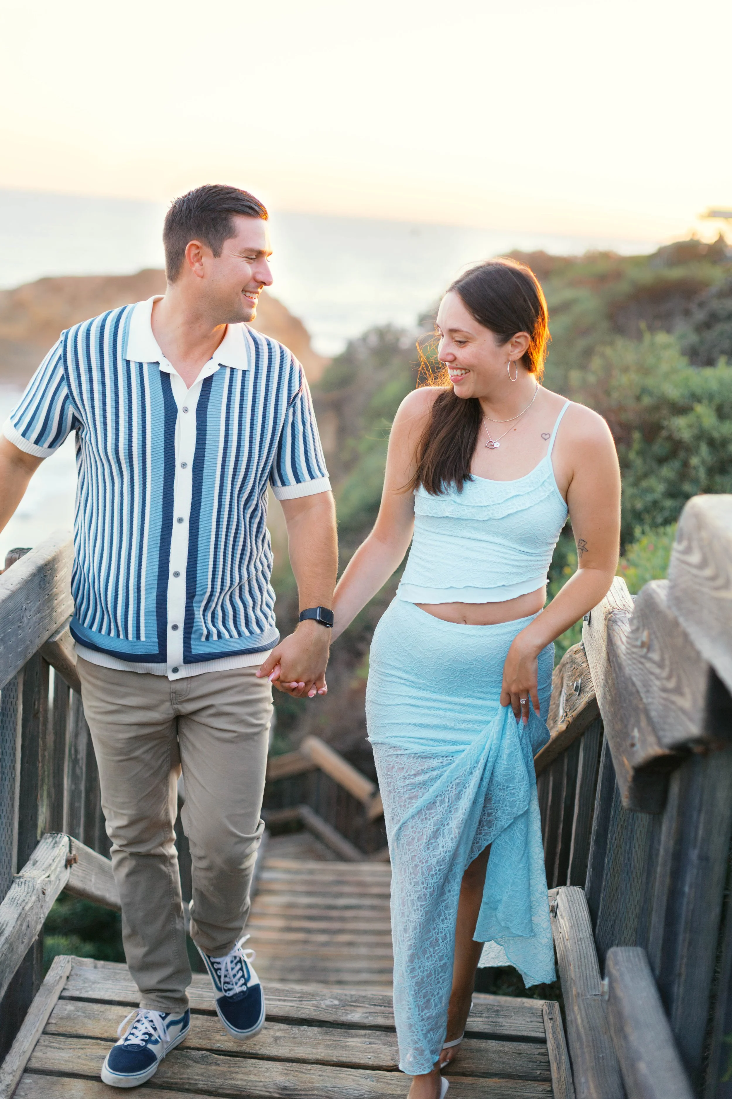 Newly engaged couple walking together near Treasure Island Beach in Laguna Beach