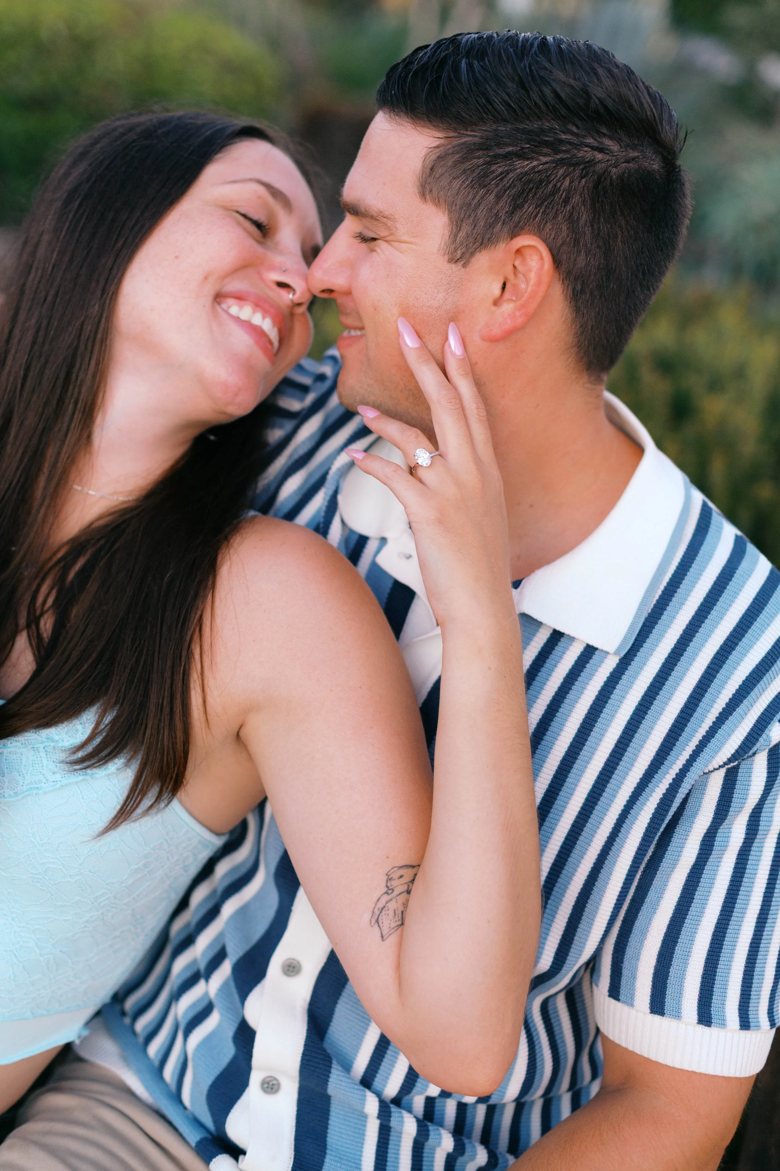Close-up engagement portrait showing the ring after a sunset proposal in Laguna Beach, photographed by Alissa Noelle Photography.