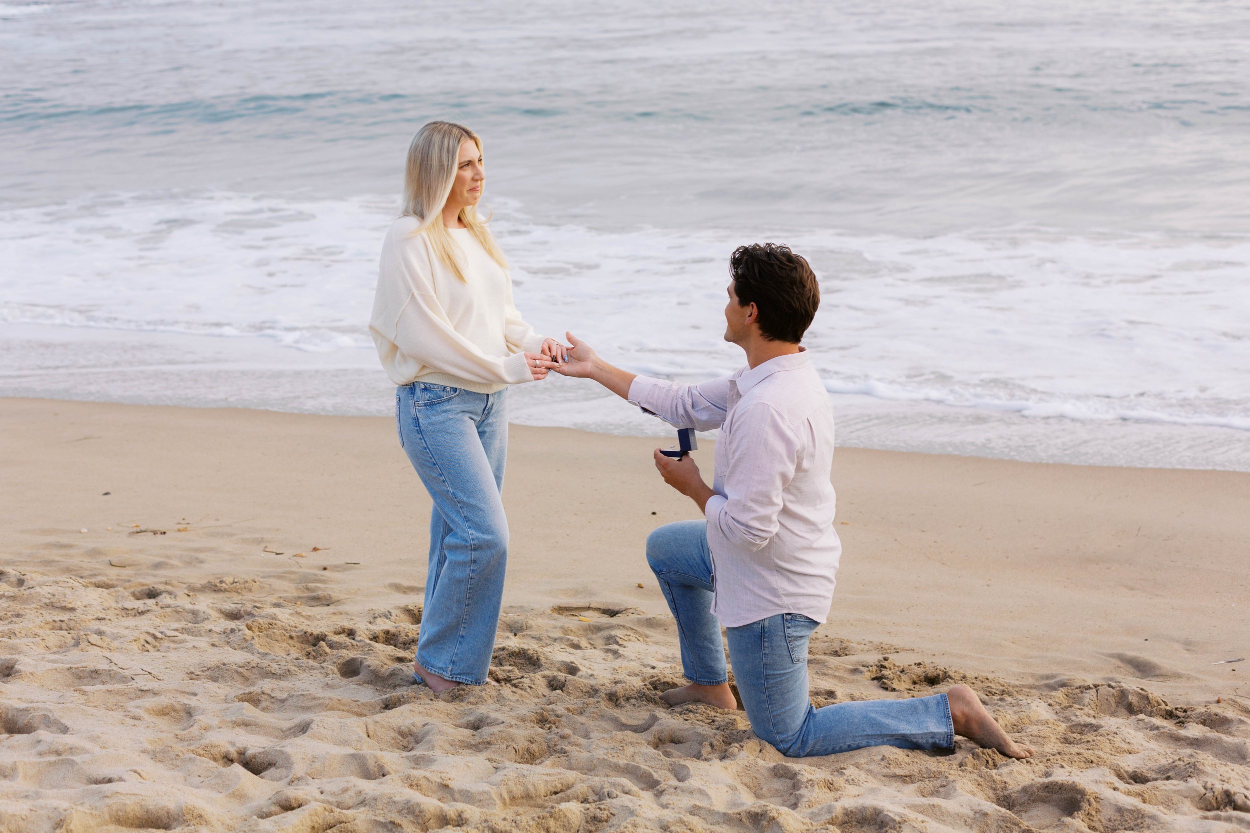 Surprise marriage proposal overlooking the ocean in Laguna Beach, photographed at golden hour.