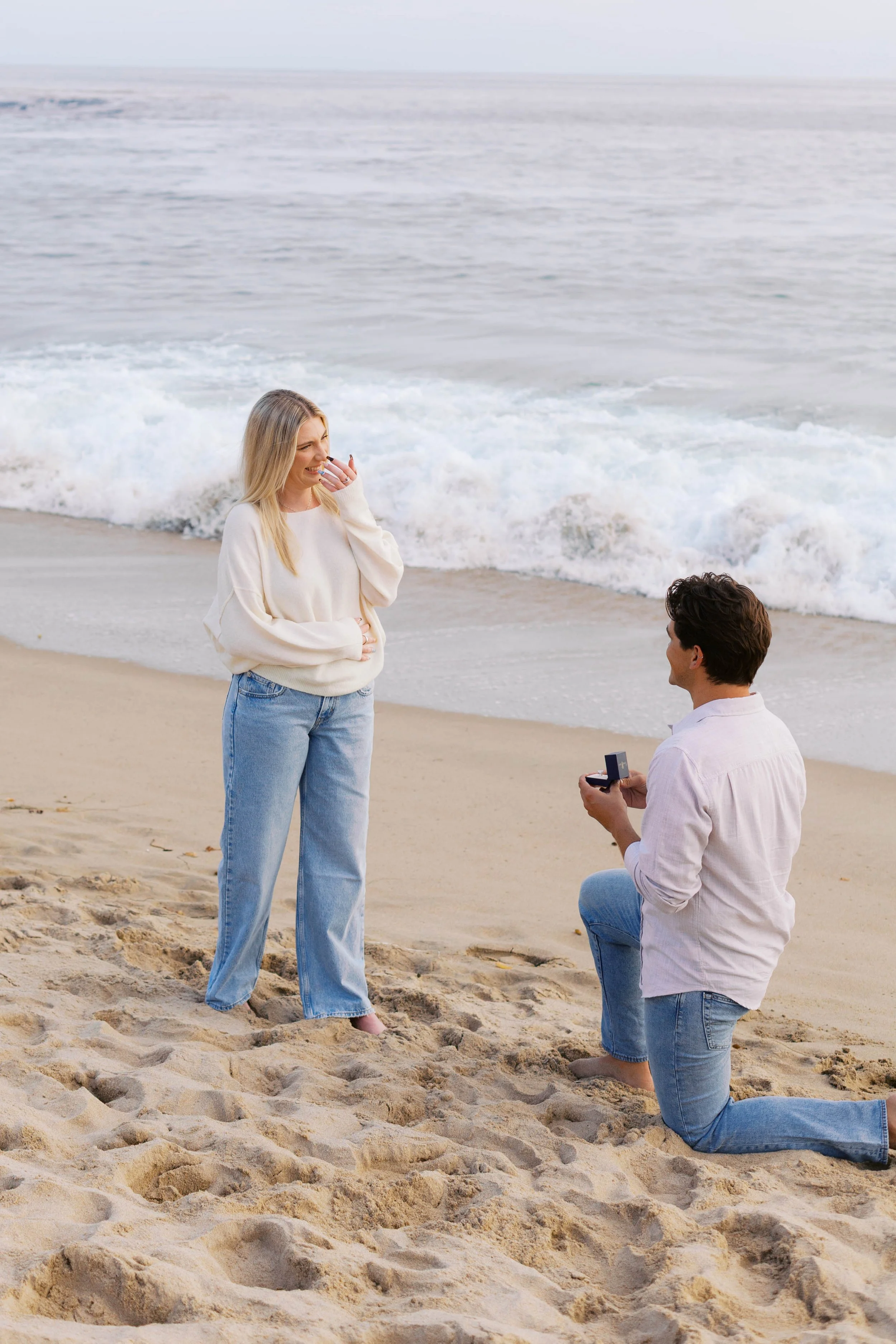 Surprise beach proposal at Emerald Bay in Laguna Beach, captured by Laguna Beach proposal photographer Alissa Noelle Photography.