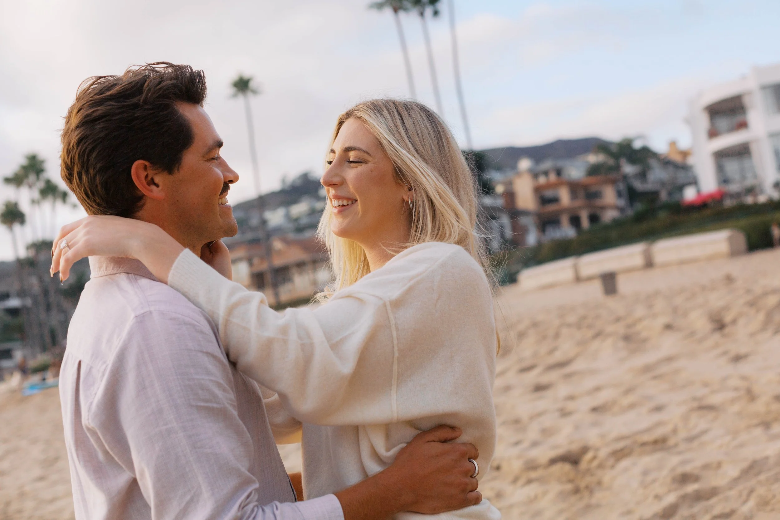 Candid engagement portrait of a couple celebrating after their Emerald Bay proposal in Laguna Beach.