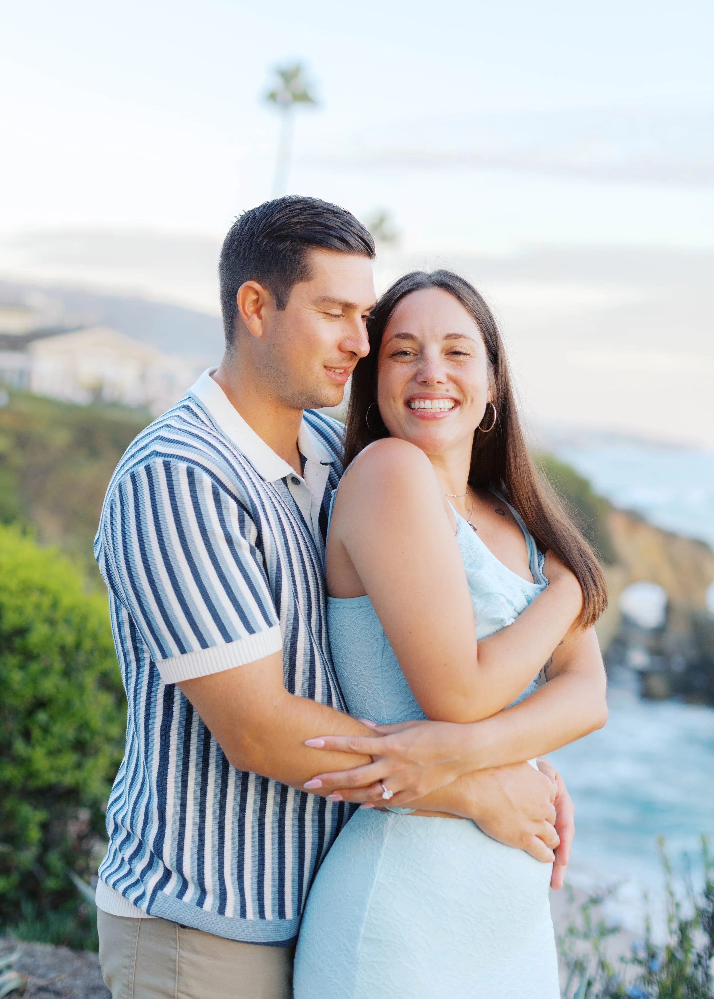 Candid engagement portrait after a Treasure Island sunset proposal, photographed by Alissa Noelle Photography.