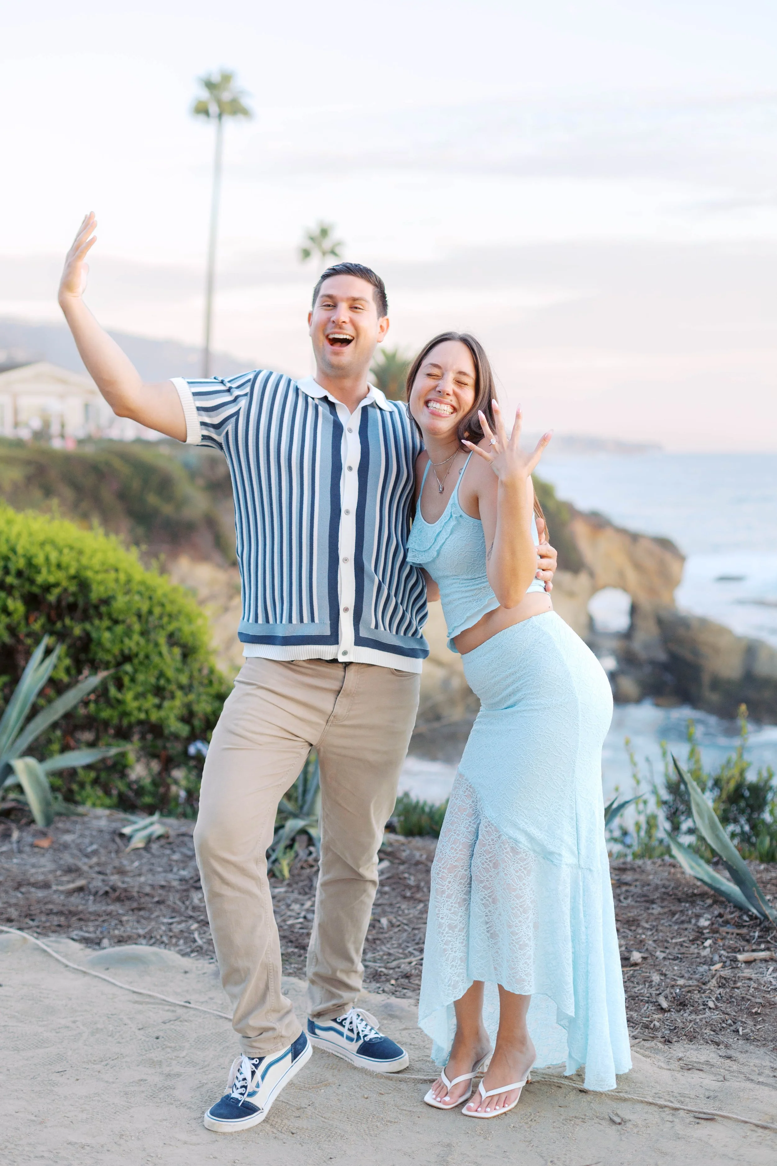 Joyful candid celebration after a sunset proposal near Treasure Island Beach, photographed by Laguna Beach proposal photographer Alissa Noelle Photography.