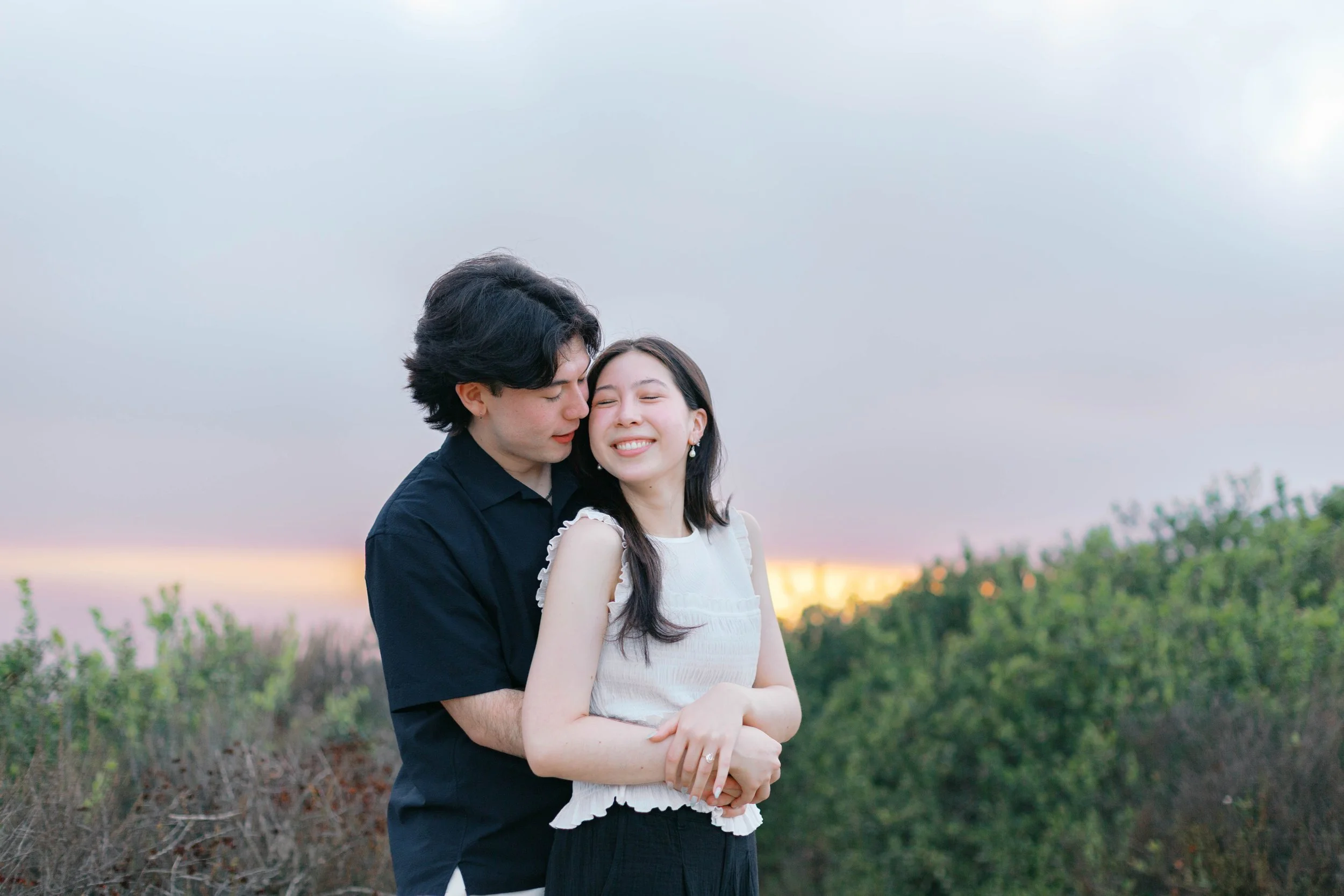 Candid laughing moment between Curtis and Eimi after their proposal.