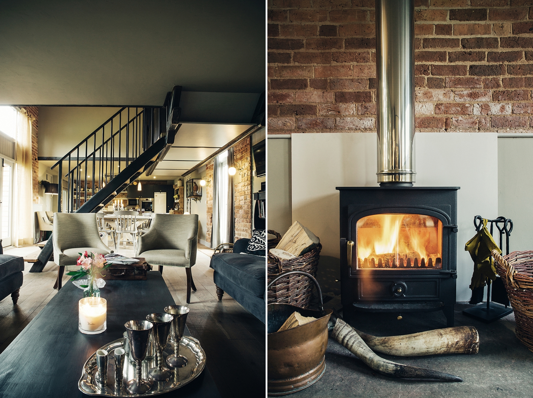 Living room with contemporary and rustic decor, including furniture and a staircase on the left. The fireplace with a roaring fire and various firewood and decorations on the right.