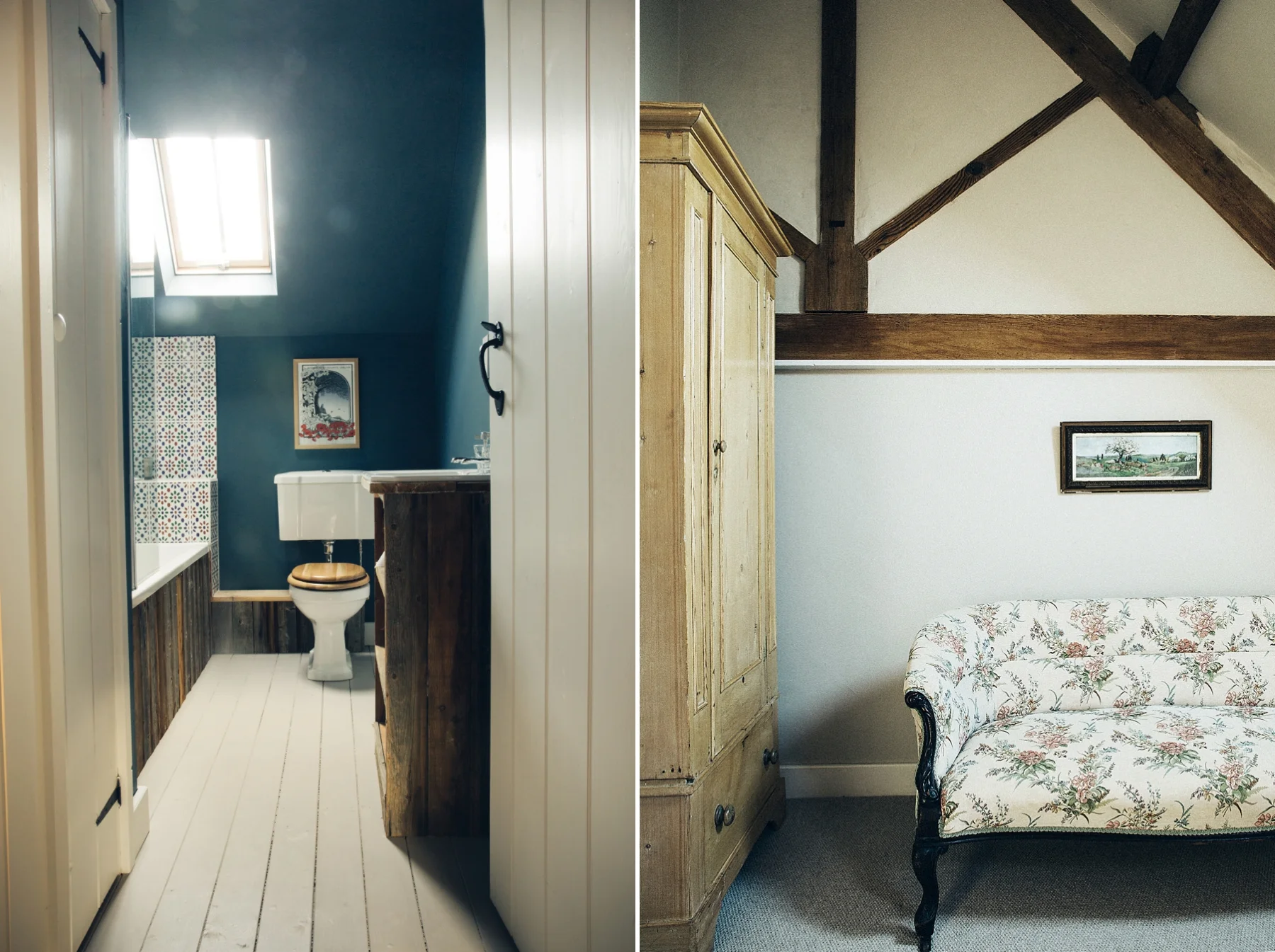 A split view of two interior spaces: on the left, a cozy bathroom with a skylight, blue walls, a toilet with a wooden seat, and patterned tiles; on the right, a room with a vintage wooden wardrobe, oak beams, white textured walls, a framed landscape 