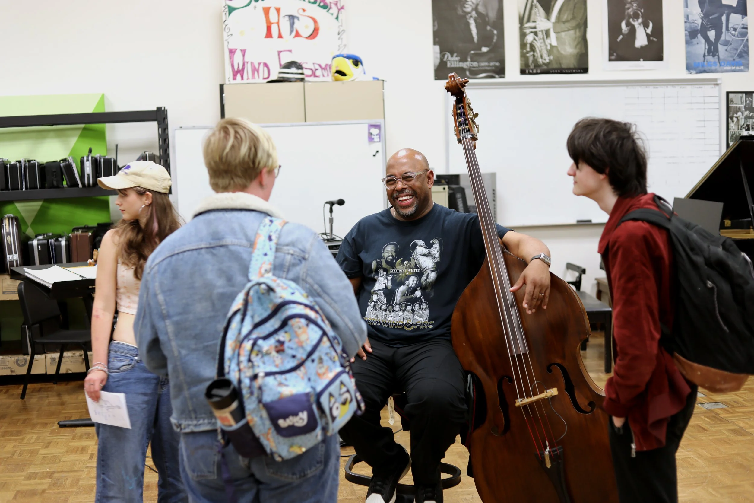 Group of students speak to Christian McBride following Arts in Education event at South Whidbey high school