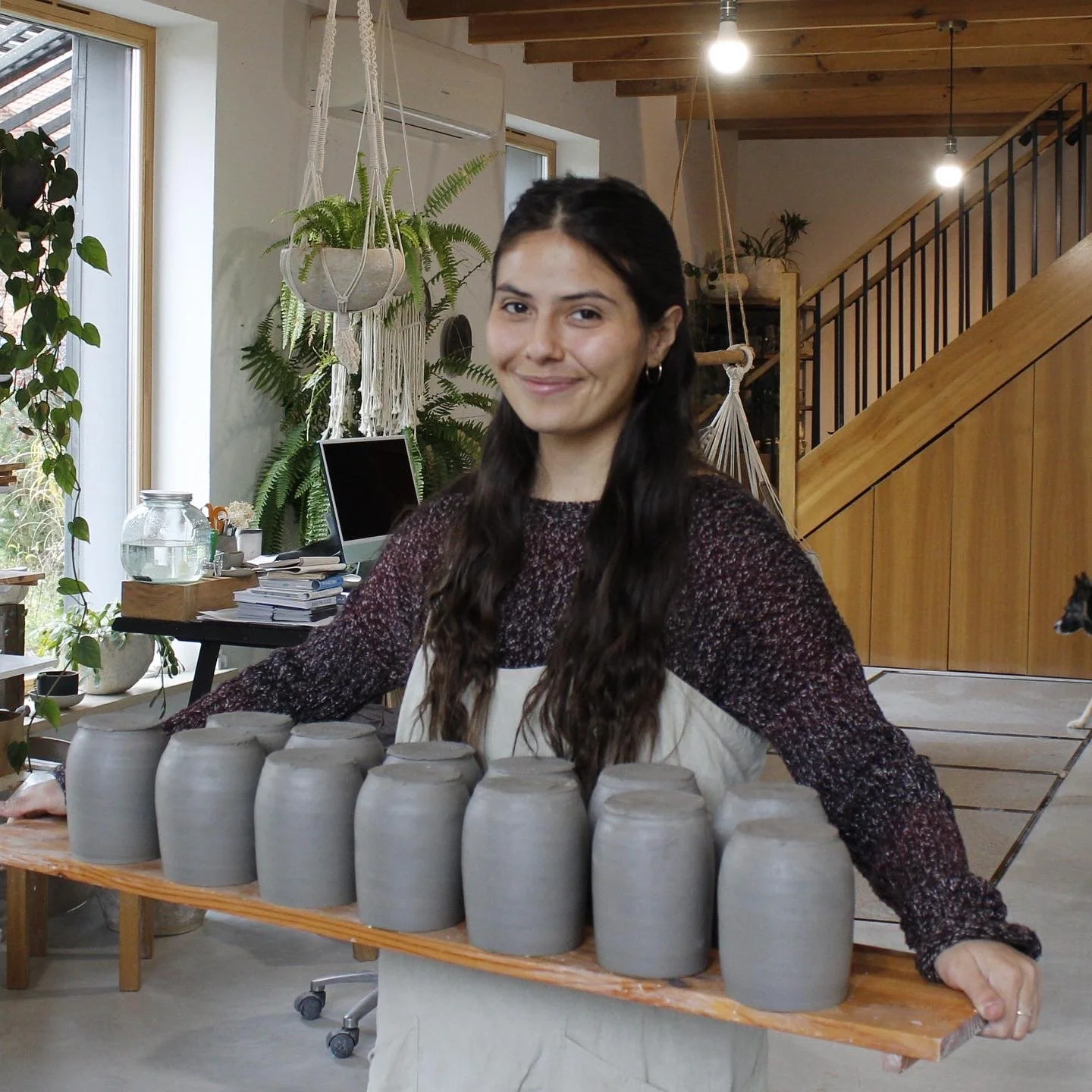 Image of Sasha Polonko holding ceramic art