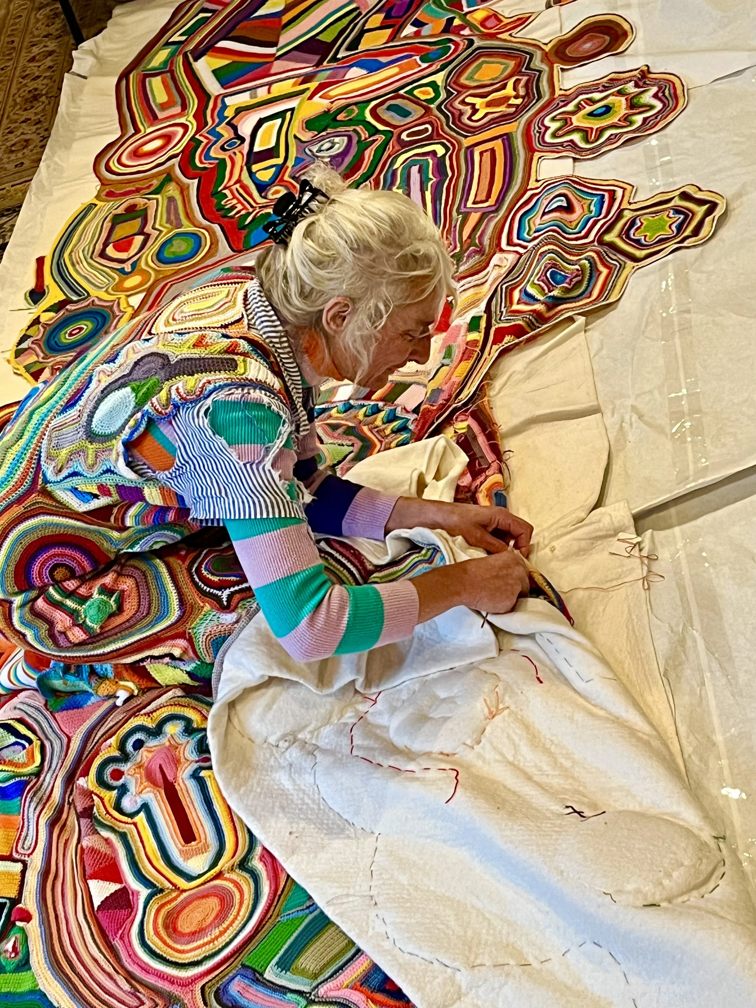 Ferry Brennan in her studio working on an art piece
