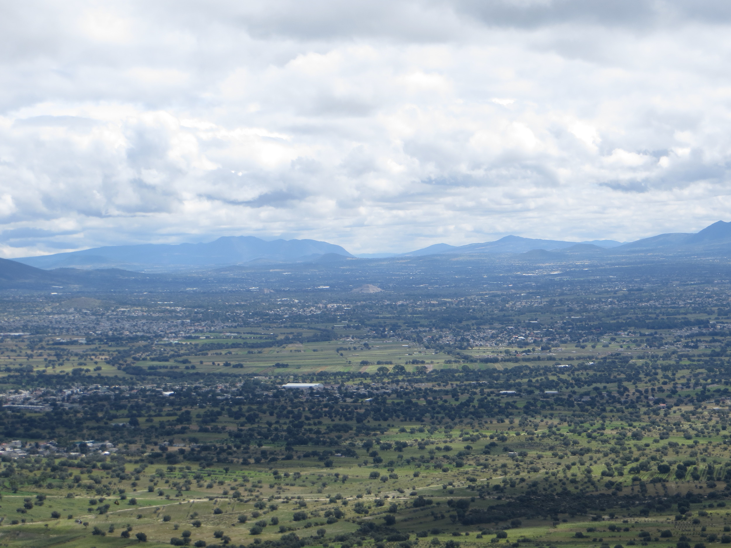 The historic Pyramids of Teotihuacan (center and center-left) as seen from the top of the Chiconautla hill