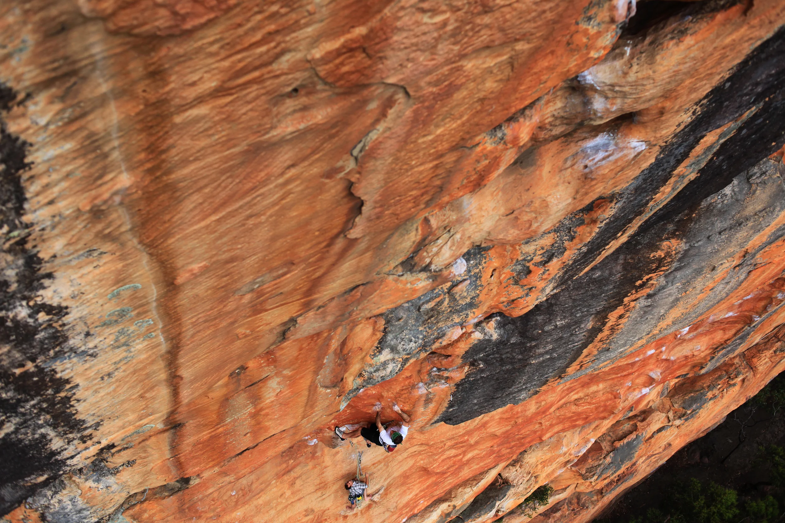 Athol Whimp pushing through the crux of another Matheson classic, Anaconda (28), Taipan Wall, 2011. Tristram Whimp on belay.