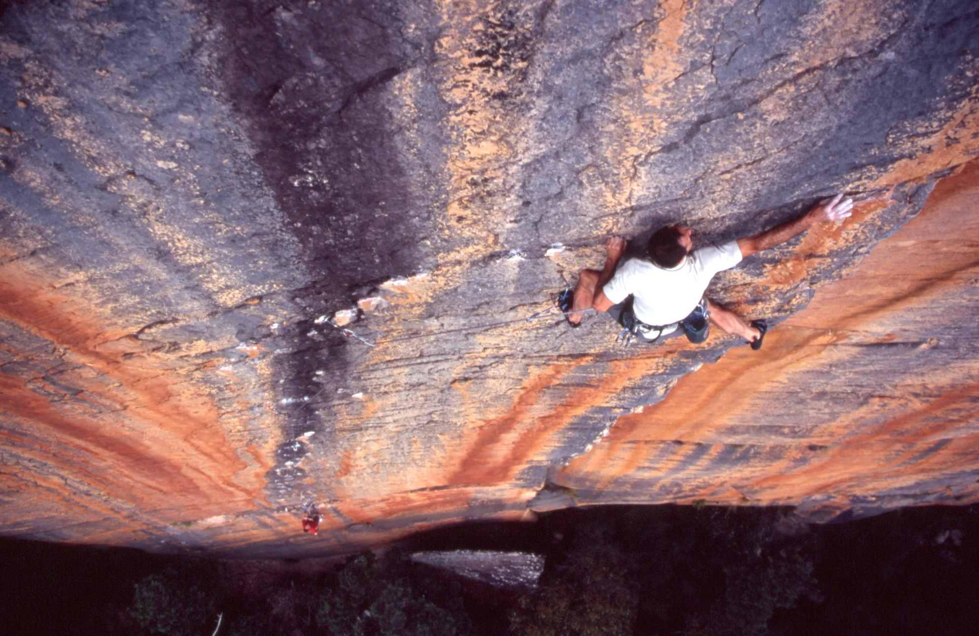 Athol putting the finishing touches on "Archimedes' Principle" (25), Eureka Wall, 2004. Rob Lindblade on belay.