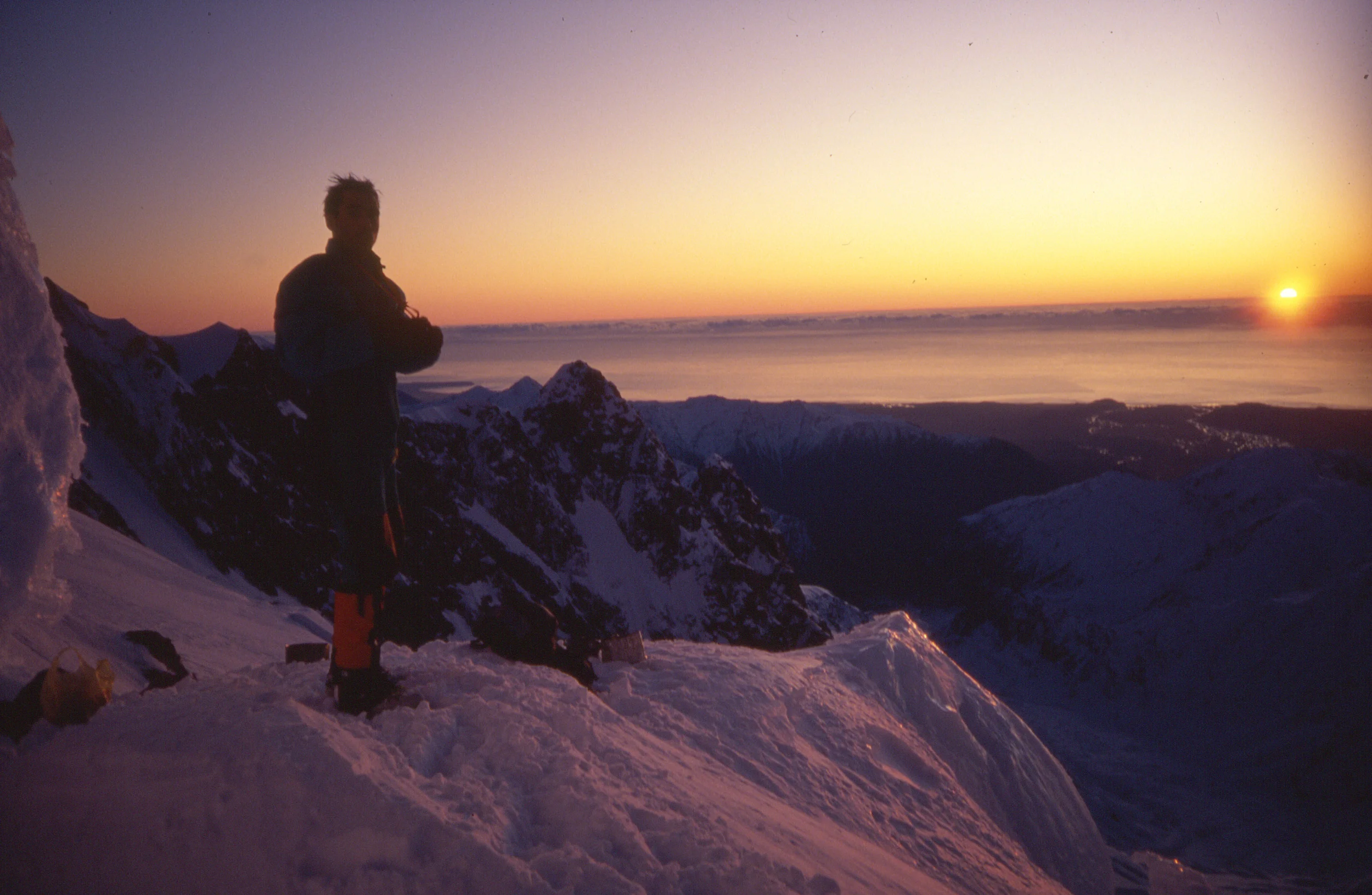 Bivy site in the Balfour neve with the west coast and Tasman ocean beyond, winter 1993.