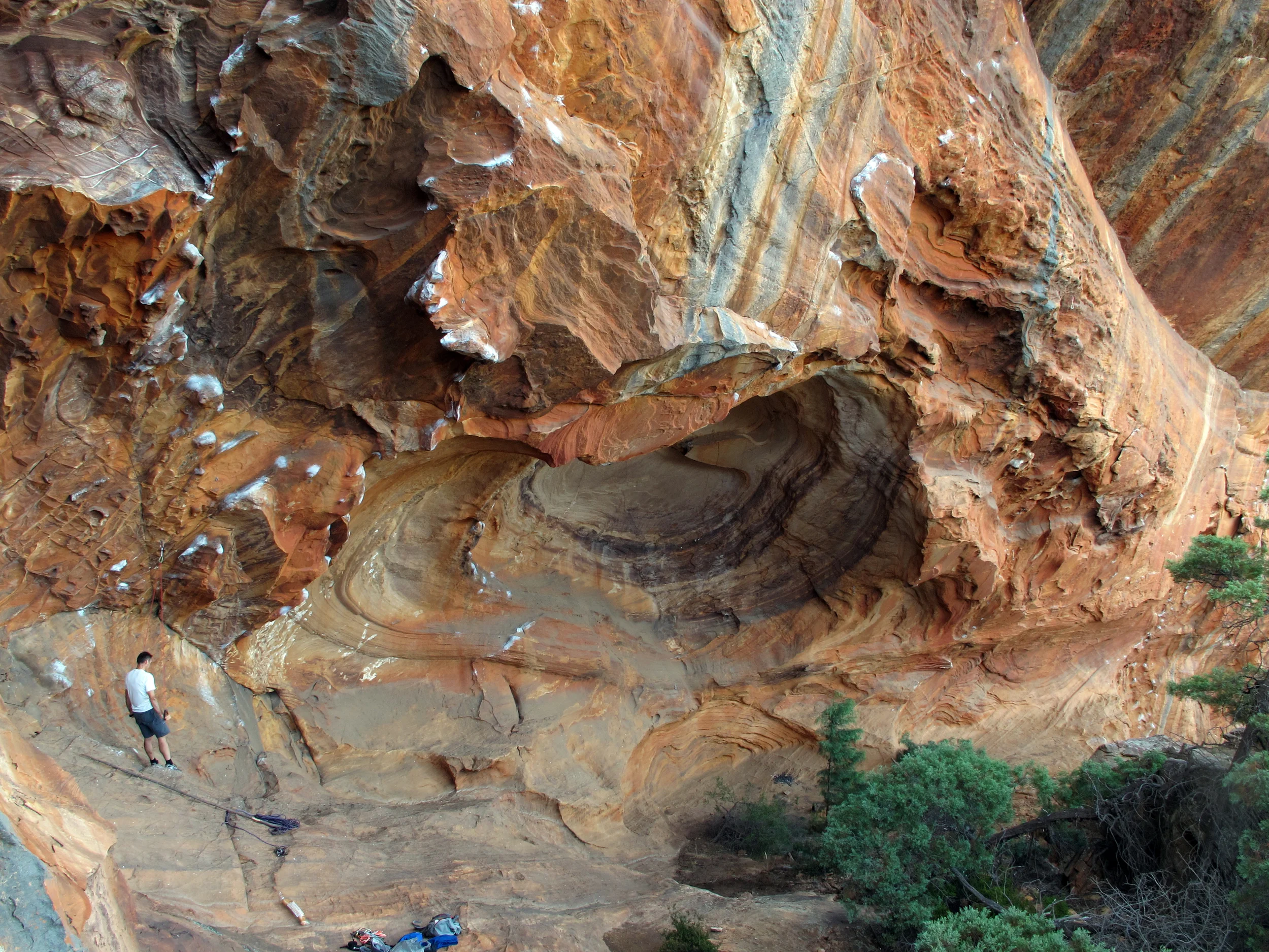 Athol warming up at the awesome Muline Wall, Grampians, summer 2012. The classic &nbsp;"Eye of the Tiger" (30) takes the left side of the "eye," traverses the roof (out of sight) and then charges up the headwall following the chalk line.&nbsp;
