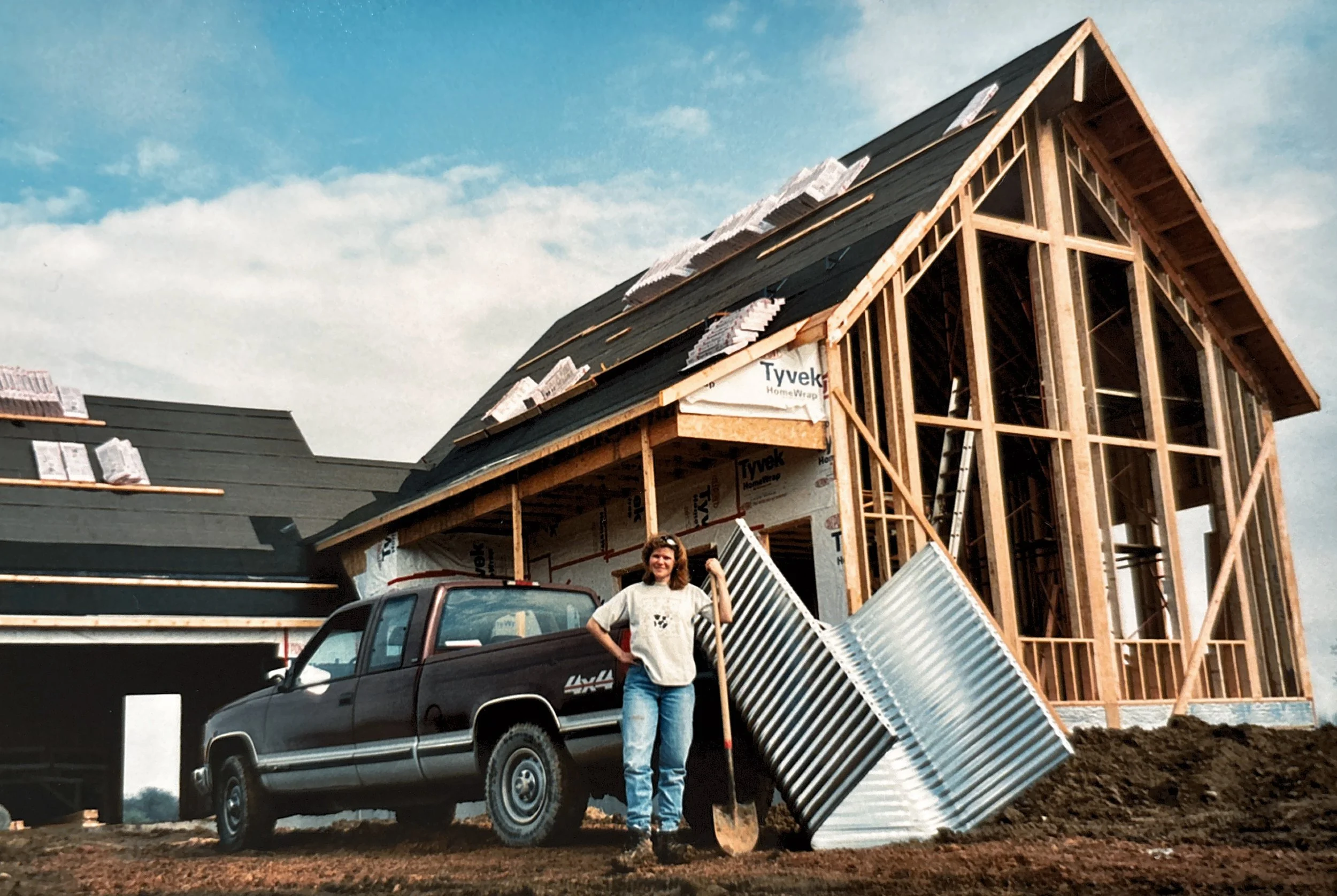 building the house standing in front of the pick up.jpg