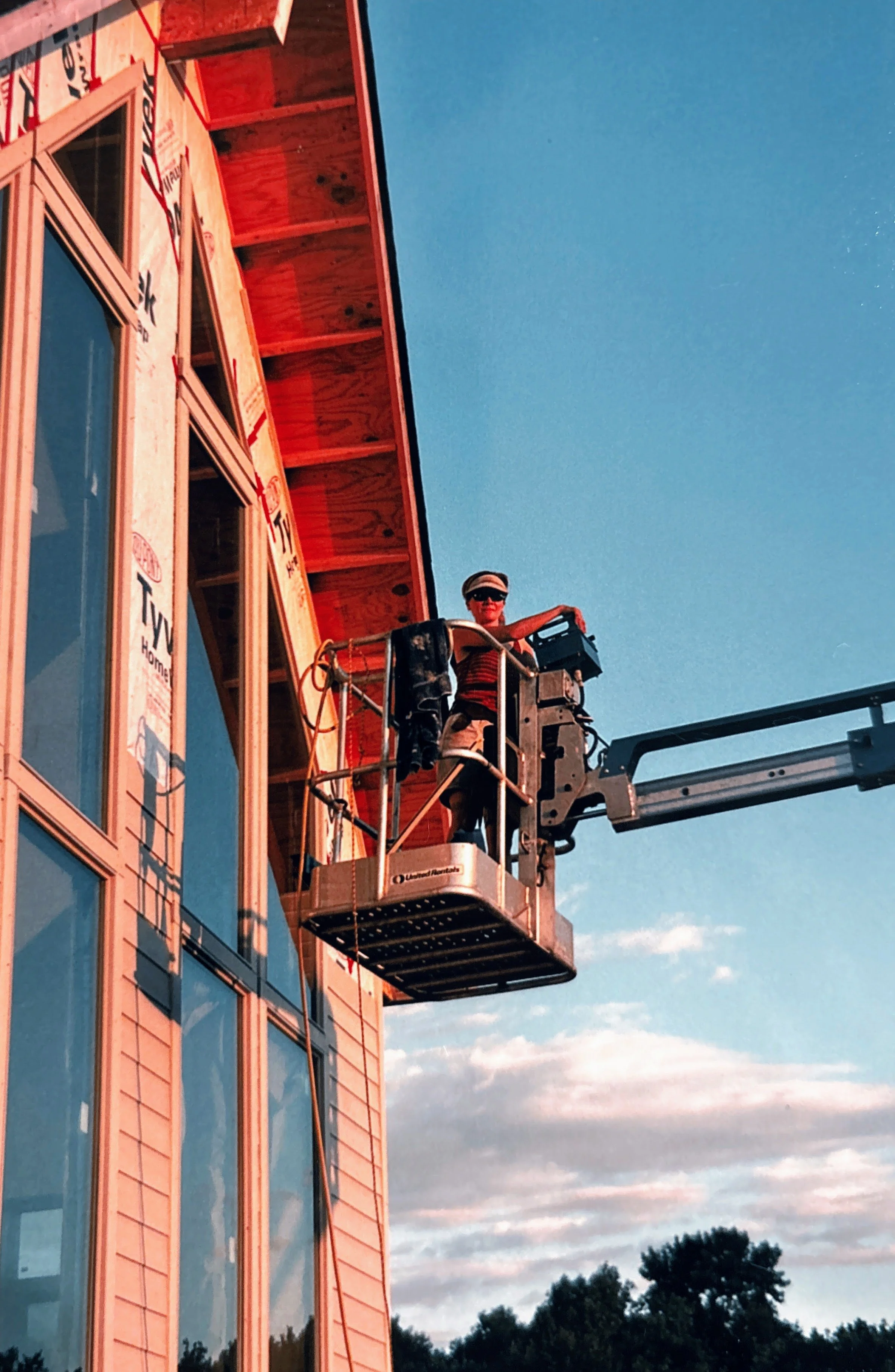 building the house, sarah in the cherry picker.jpg
