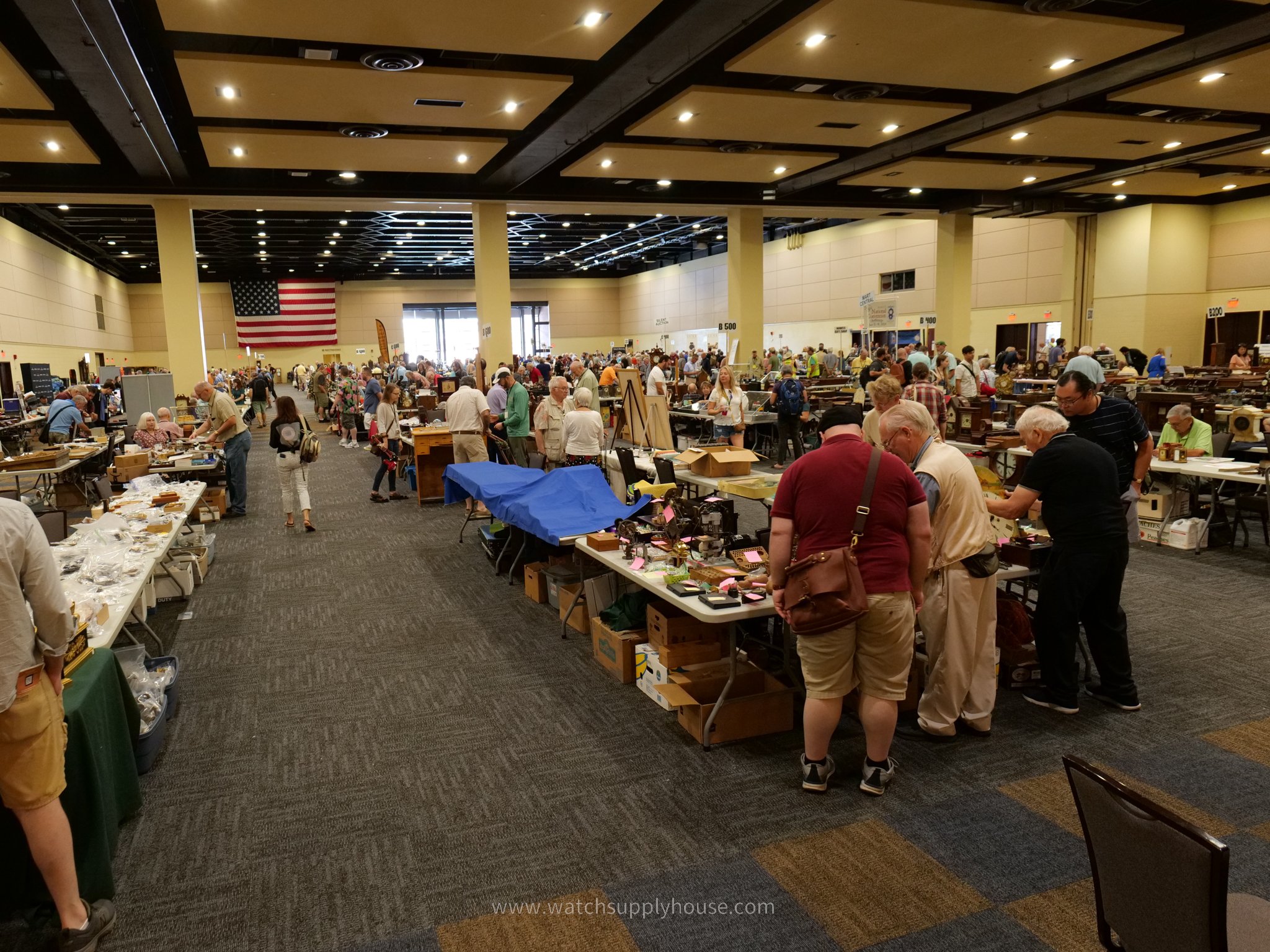 Crowded room of dealers and collectors