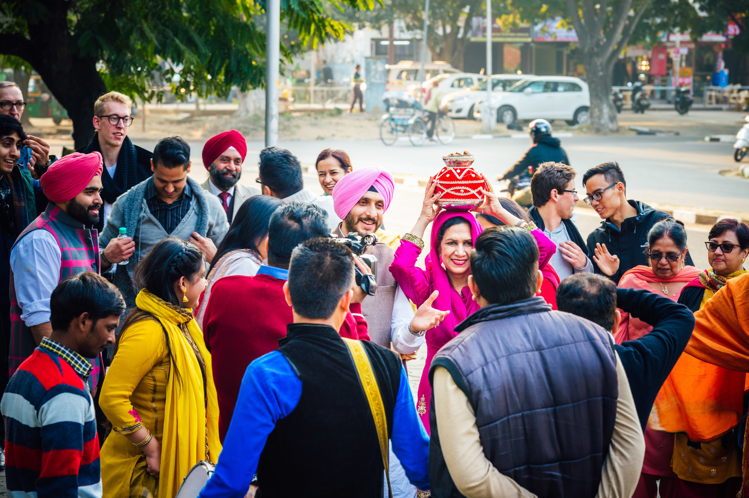  A picture of the Groom's mother holding the Gharoli on her head. 