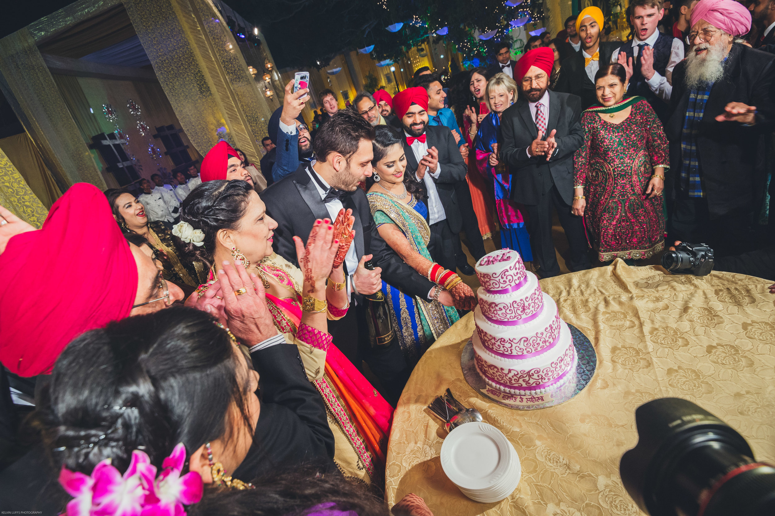  Cake cutting for the couple during the wedding reception. 