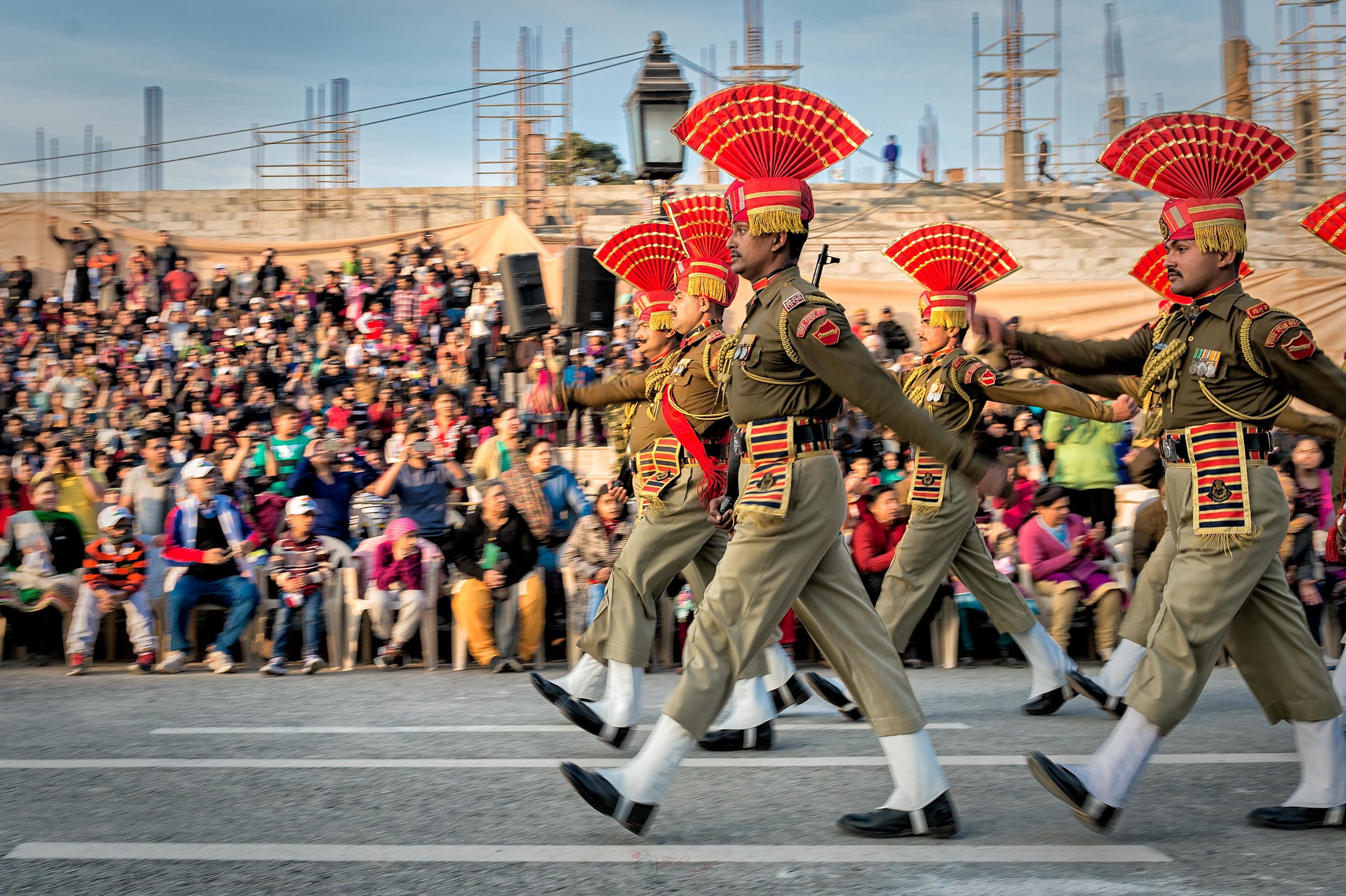  After the battle cry, these stone-faced guards marched down the road towards the Pakistani border. They then began to display a series of synchronized stomps, high kicks, aggressive body jerks and headgear adjustments along with their serious expres