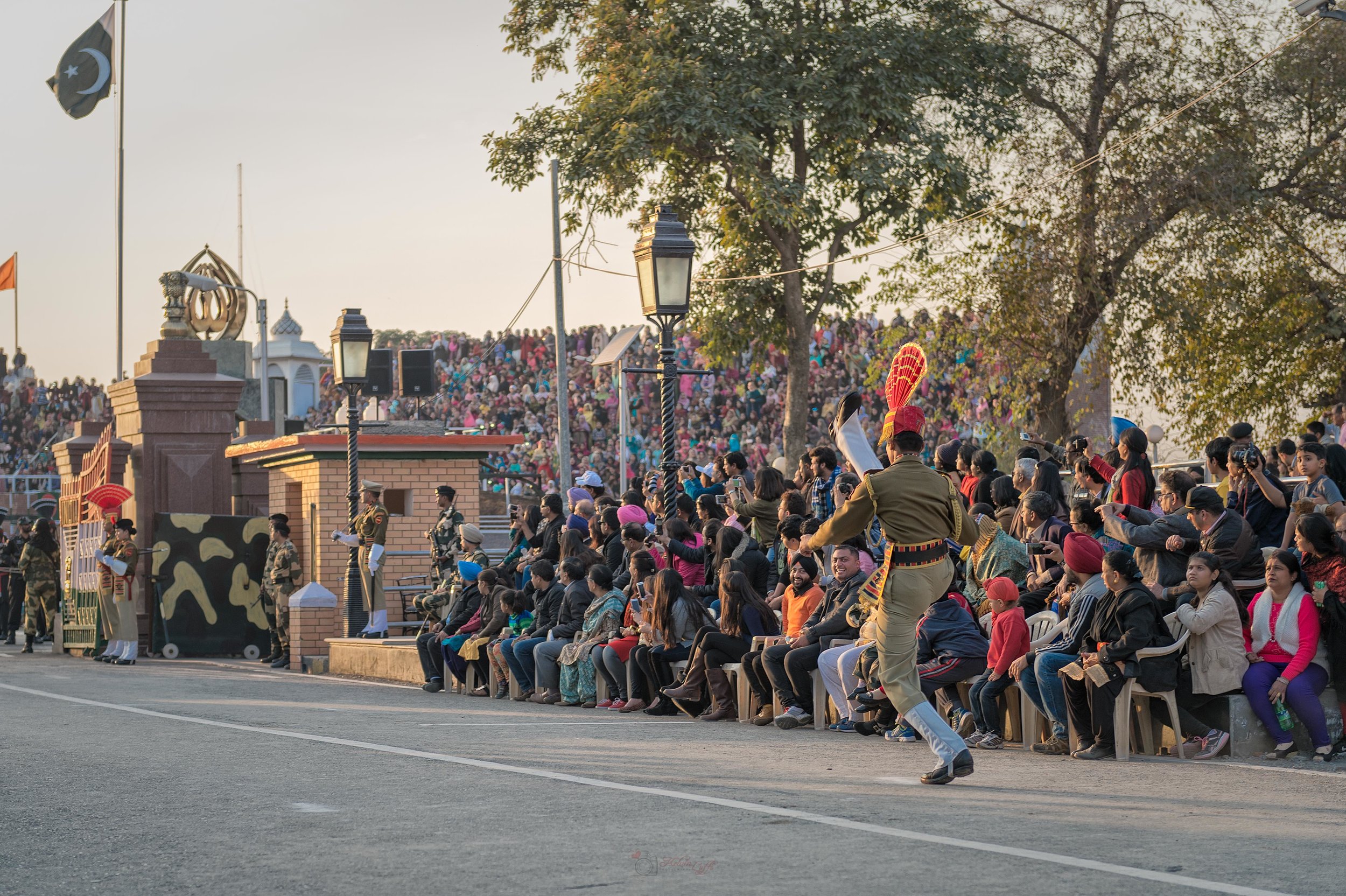  Right after the battle cry, the guard starts to complete a series of stomps and high kicks going towards the Pakistani gate. 