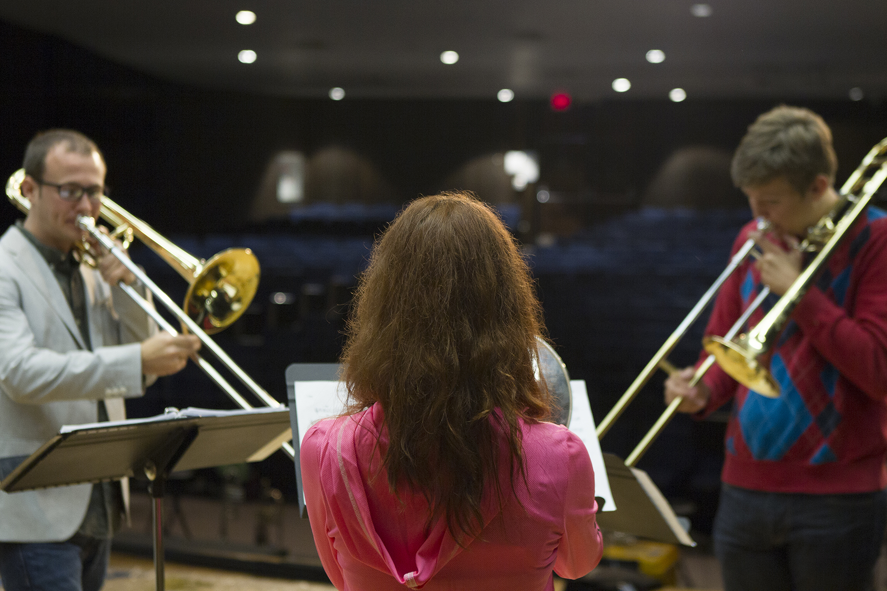 Students Mikayla Murphy, center, and Brad Halloran, right, practice Monday during a rehearsal with Caleb Ketcham from visiting band Masterworks 6.