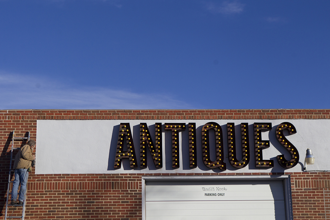 An employee with Salt Lake City based Brimley Neon works to install signage on the Frontier Auto Museum Tuesday January 5, 2016, on the corner of West Second Street and Ross Avenue. The museum featuring regional gasoline and automotive industry relics, founded by L&H Industrial Vice President Jeff Wandler, opens to the public Friday at 10 a.m.
