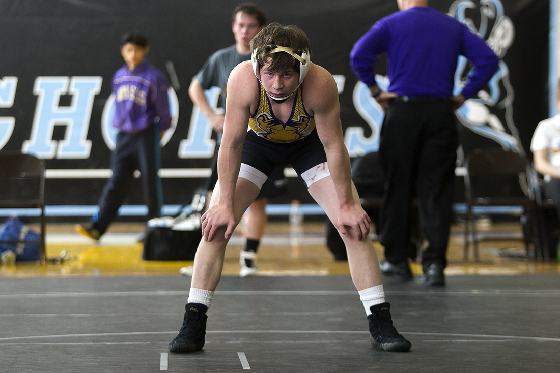 Gillette's Trevor Jeffries waits on the mat Saturday January 30, 2016 while his opponent Tommy Neal gets looked at by a trainer during the Camels duel against Cheyenne East at CCHS South Campus. The camels beat the Thunderbirds 41-28.