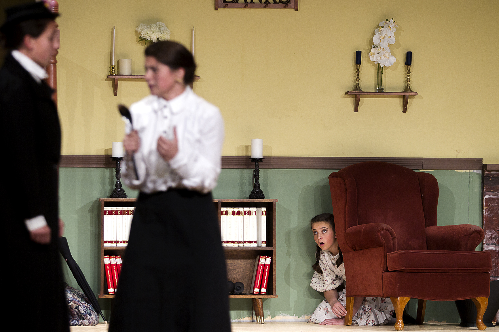 Misteen English, right, playing Jane Banks watches Anna Capron, center, and AnneMarie Gutierrez, Miss Andrew and Marry Poppins, during the final rehearsal for Campbell County High School's production of Mary Poppins, which opens Thursday night.